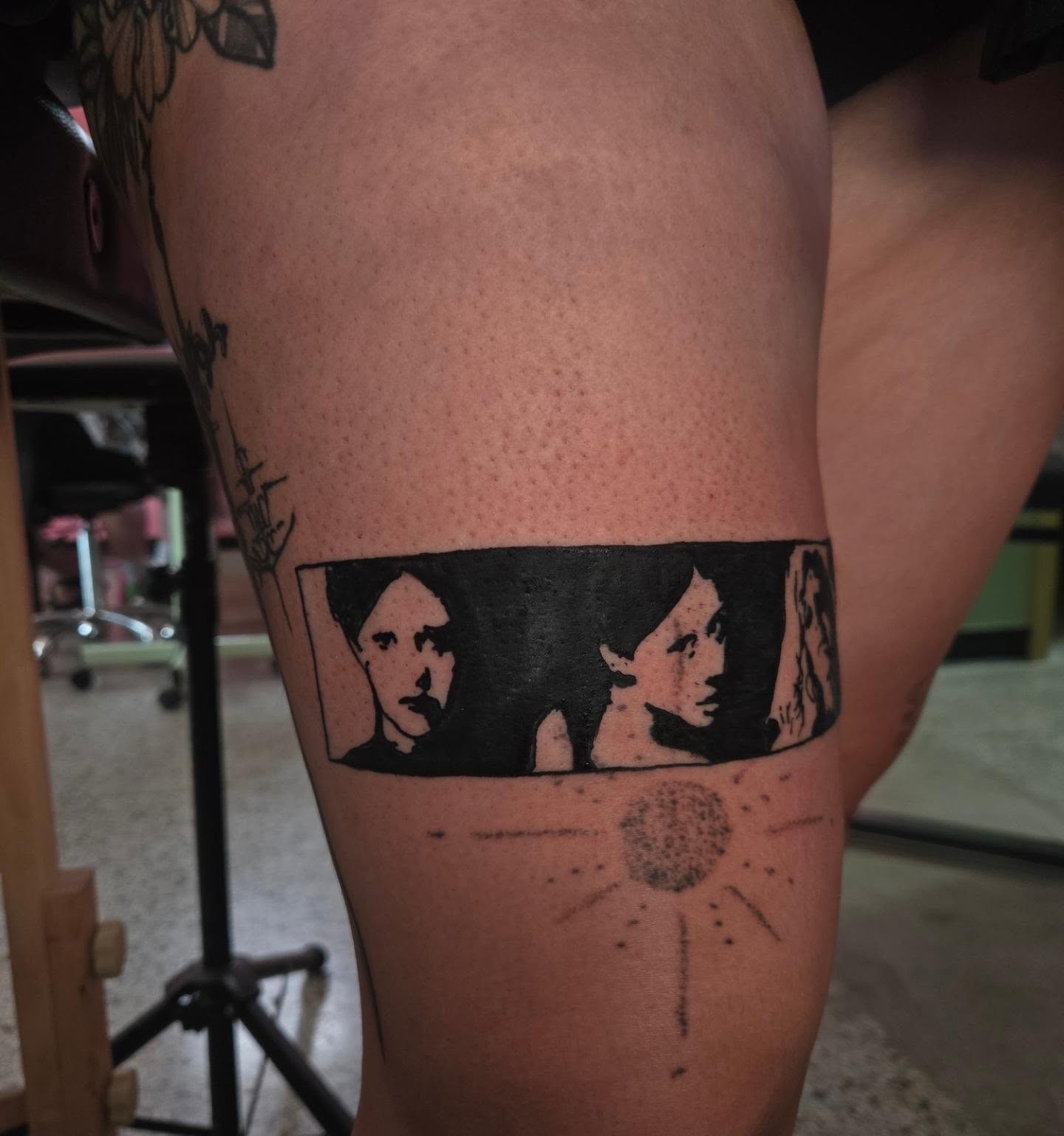 Three faces black and grey tattoo on the thigh by Lane