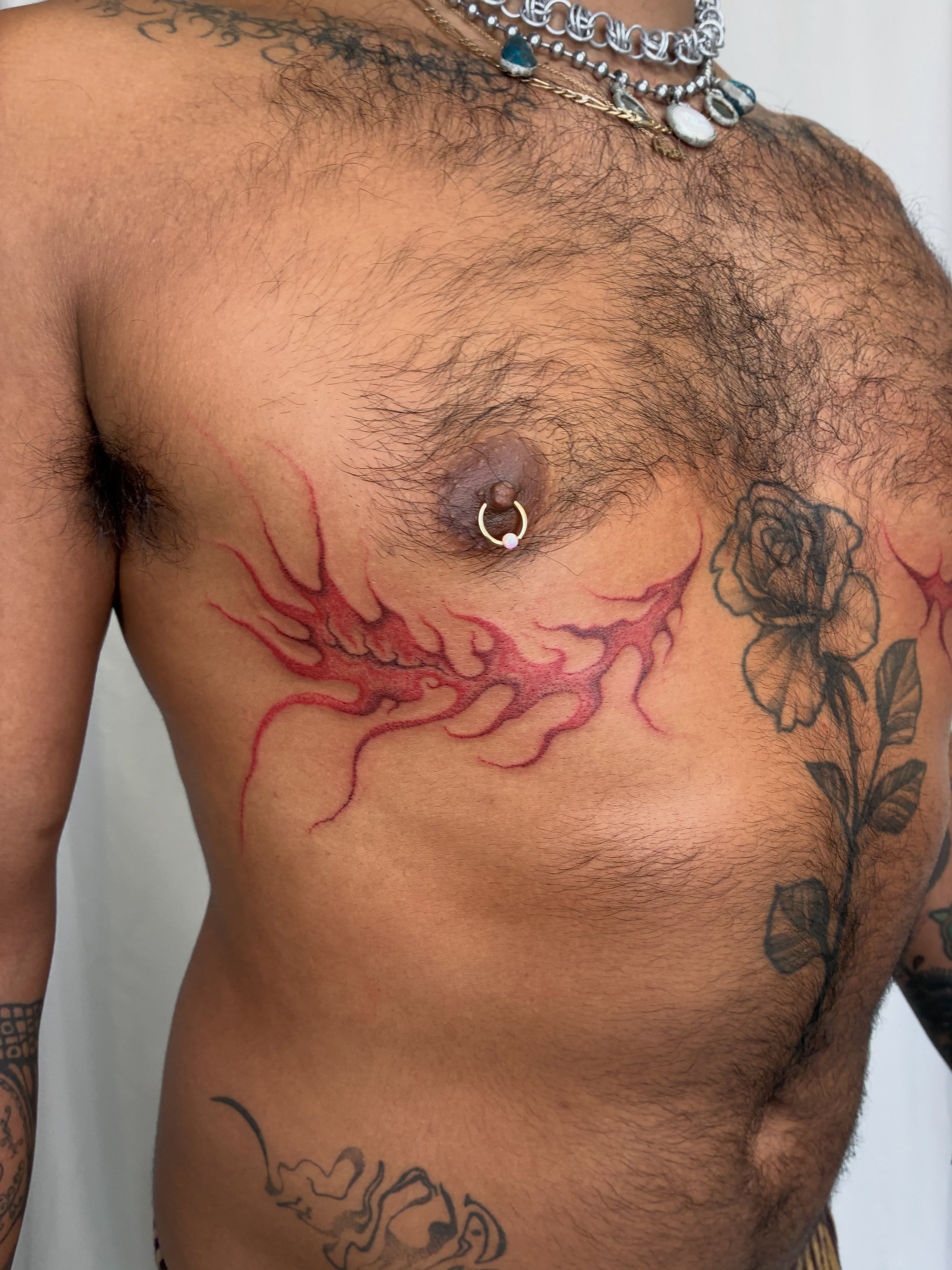 Blood splatter and flower black and grey tattoo on the chest by ∘≁≀Gæish∀ ⍕ ◯⊂ⅇl⌾tl≀≁∘