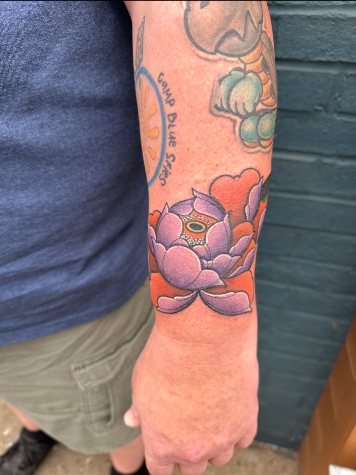 Lotus flower japanese irezumi tattoo on the forearm by Chi, Charlotte, North Carolina