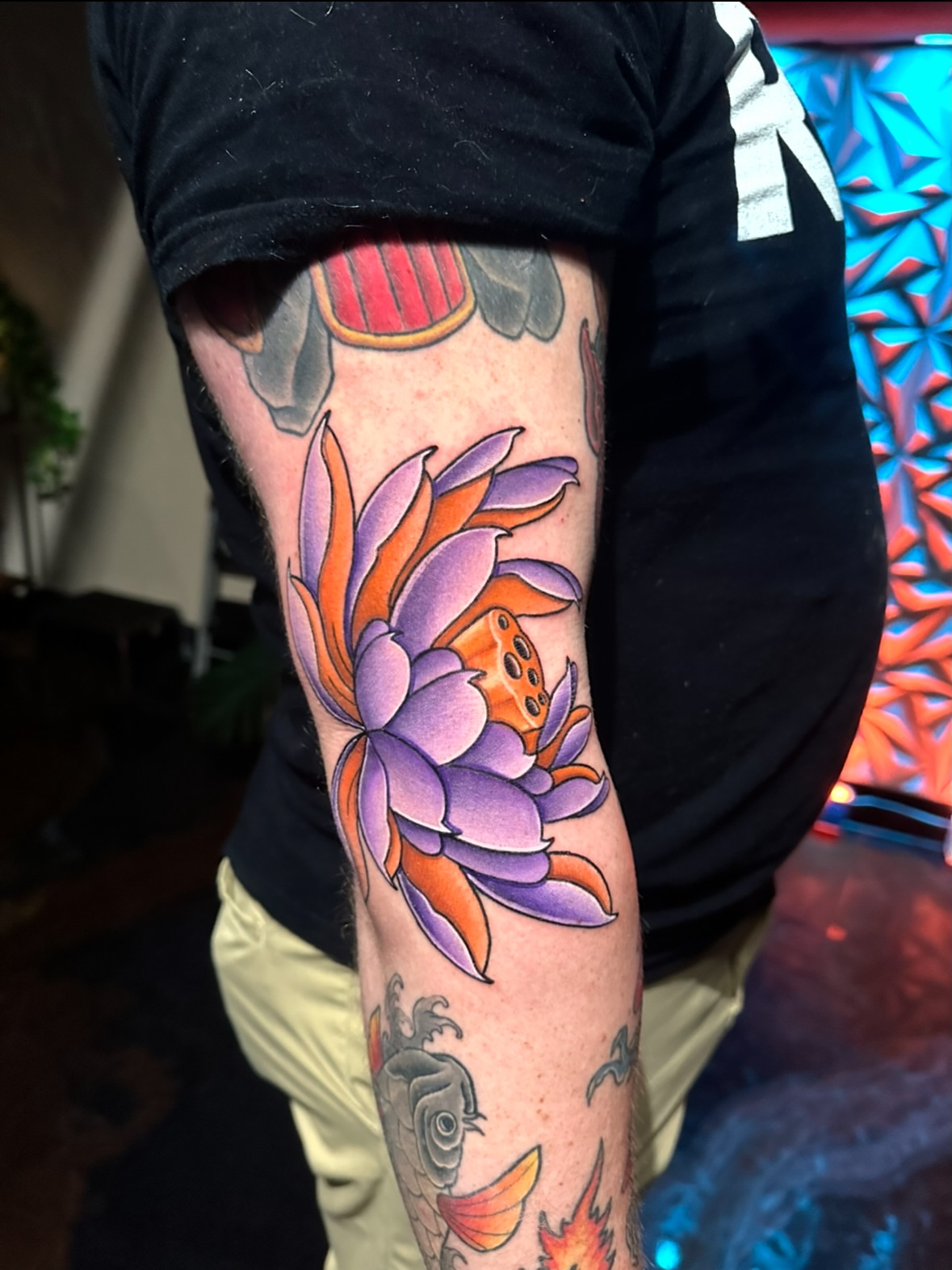 Lotus flower American traditional tattoo on the forearm by Chi, Charlotte, North Carolina