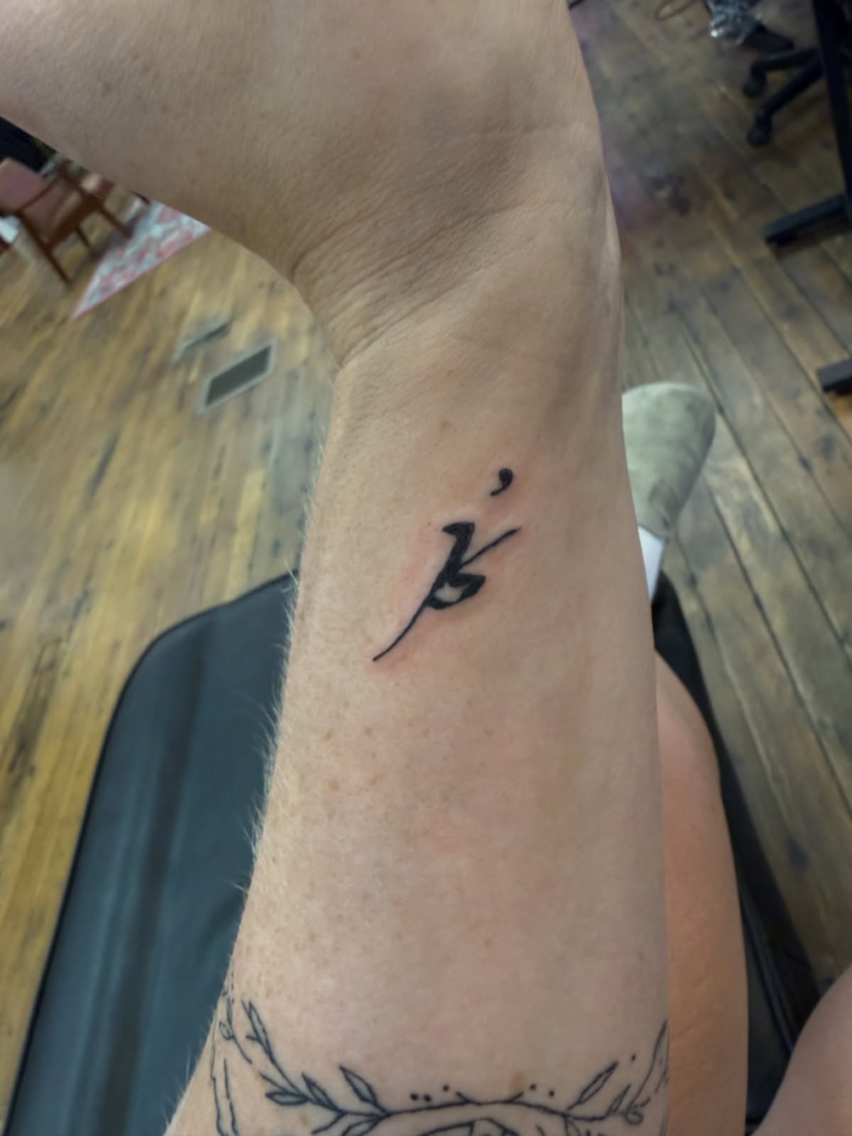 Calligraphy lettering script tattoo on the forearm by Whimsy Ink