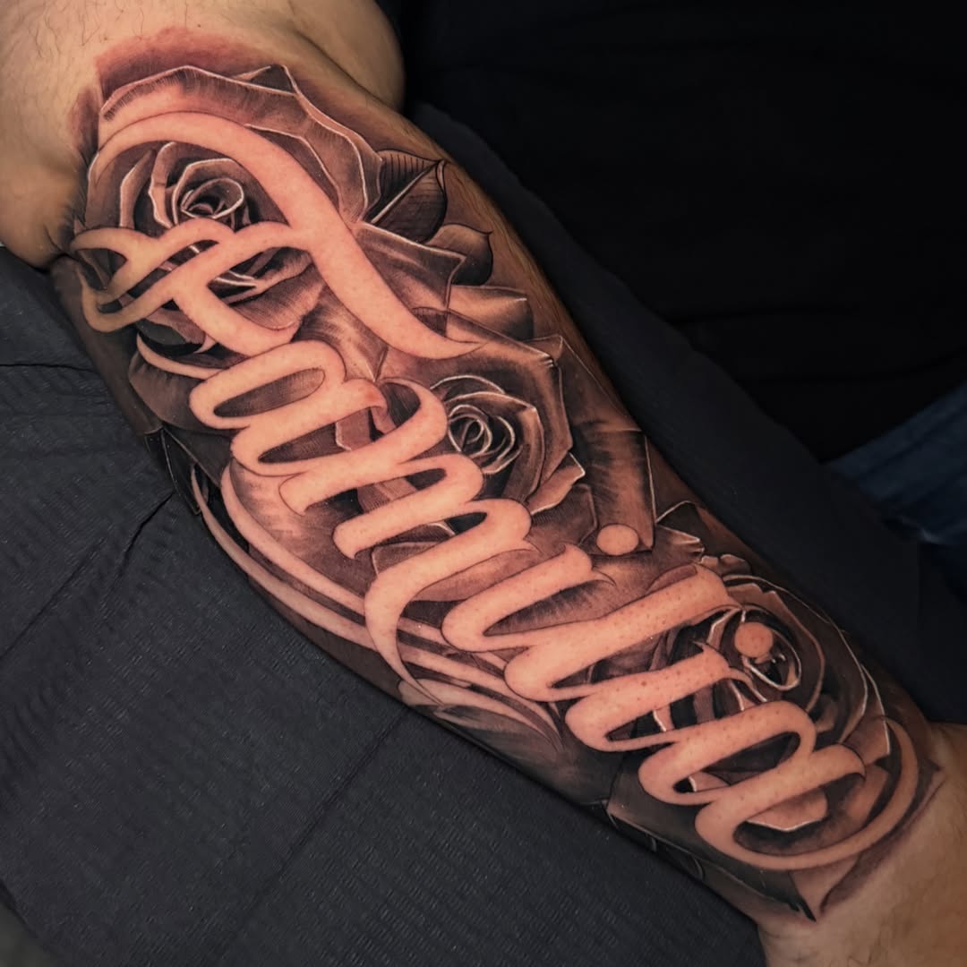Roses and spiral realism tattoo on the forearm by Flames, Cerritos, California