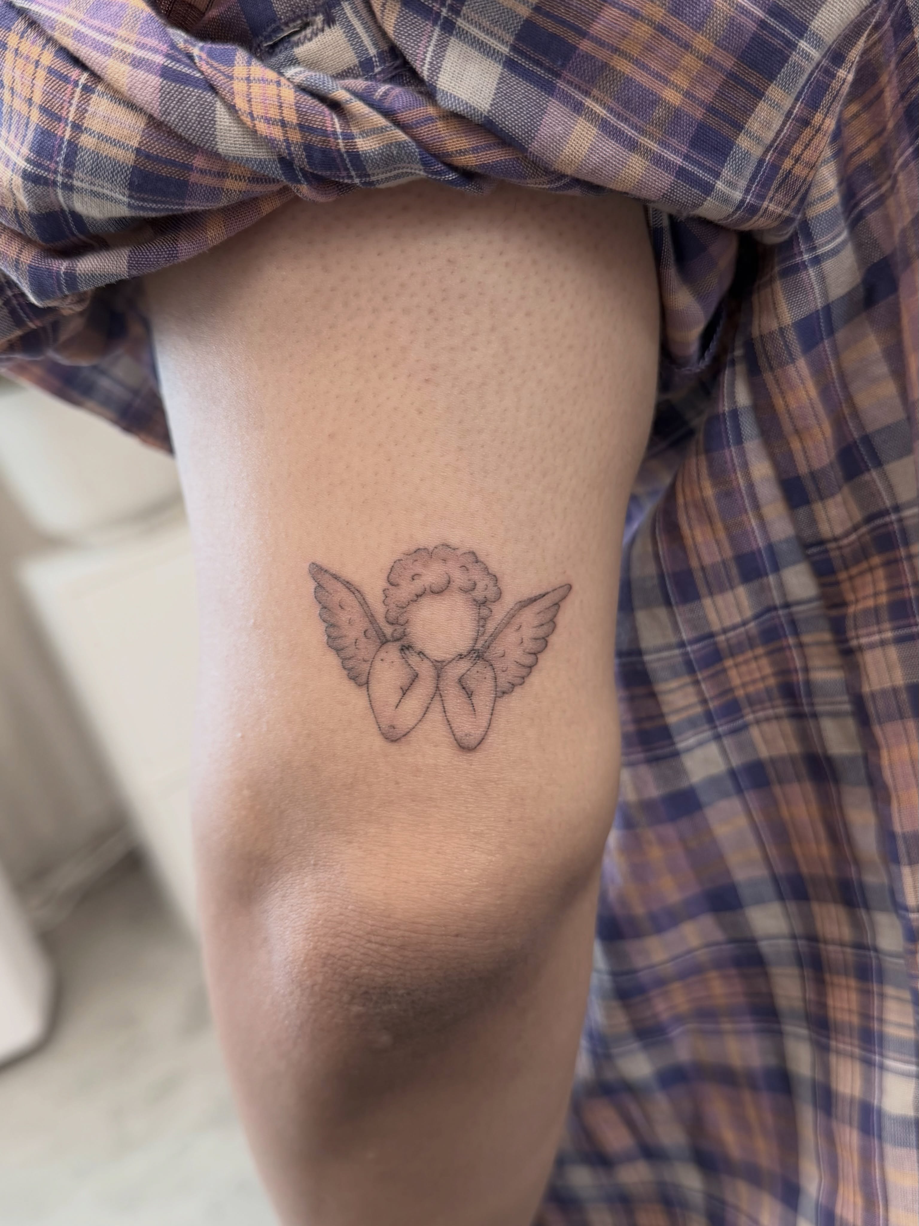 Angel wings black and grey tattoo on the forearm by Anna