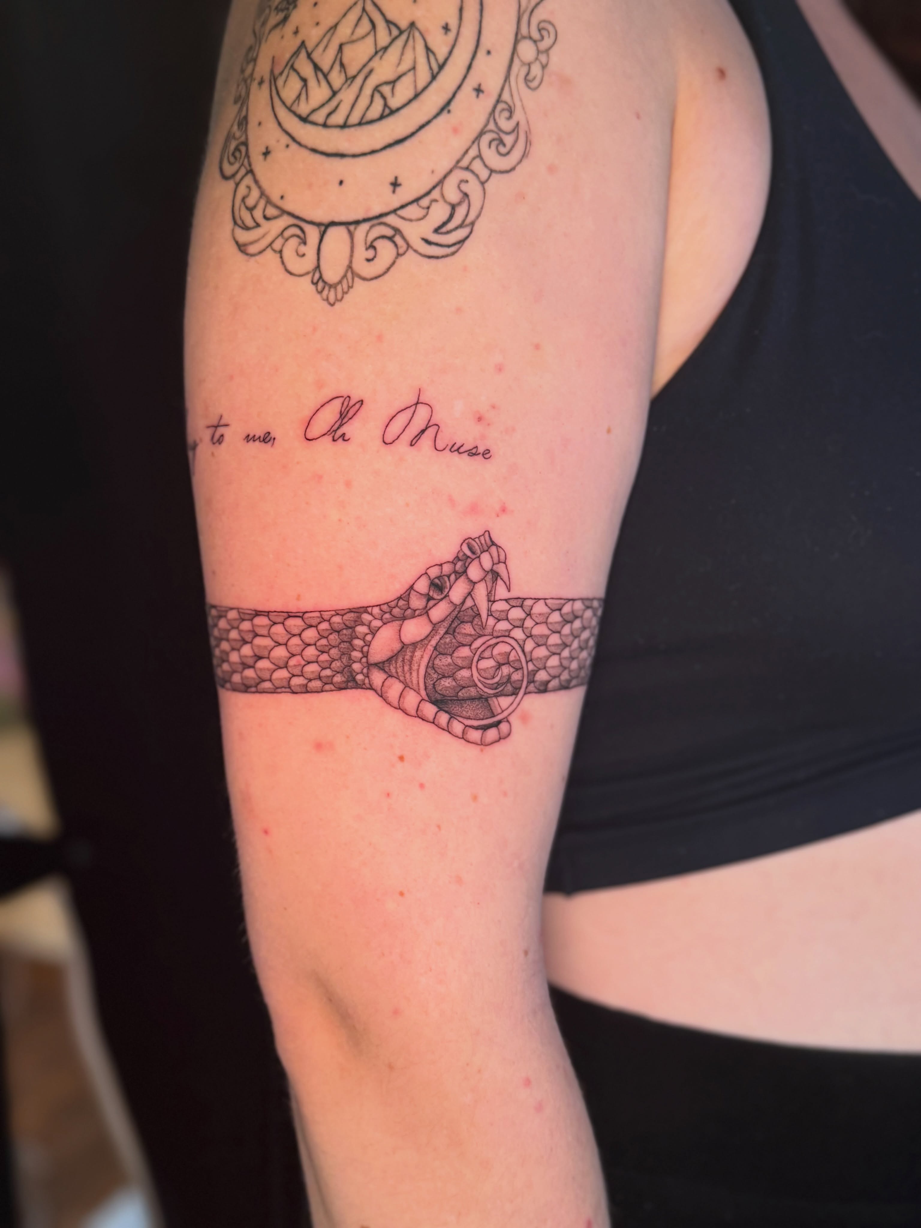 Snake and knot black and grey tattoo on the forearm by Olivia, Royal Oak, Michigan