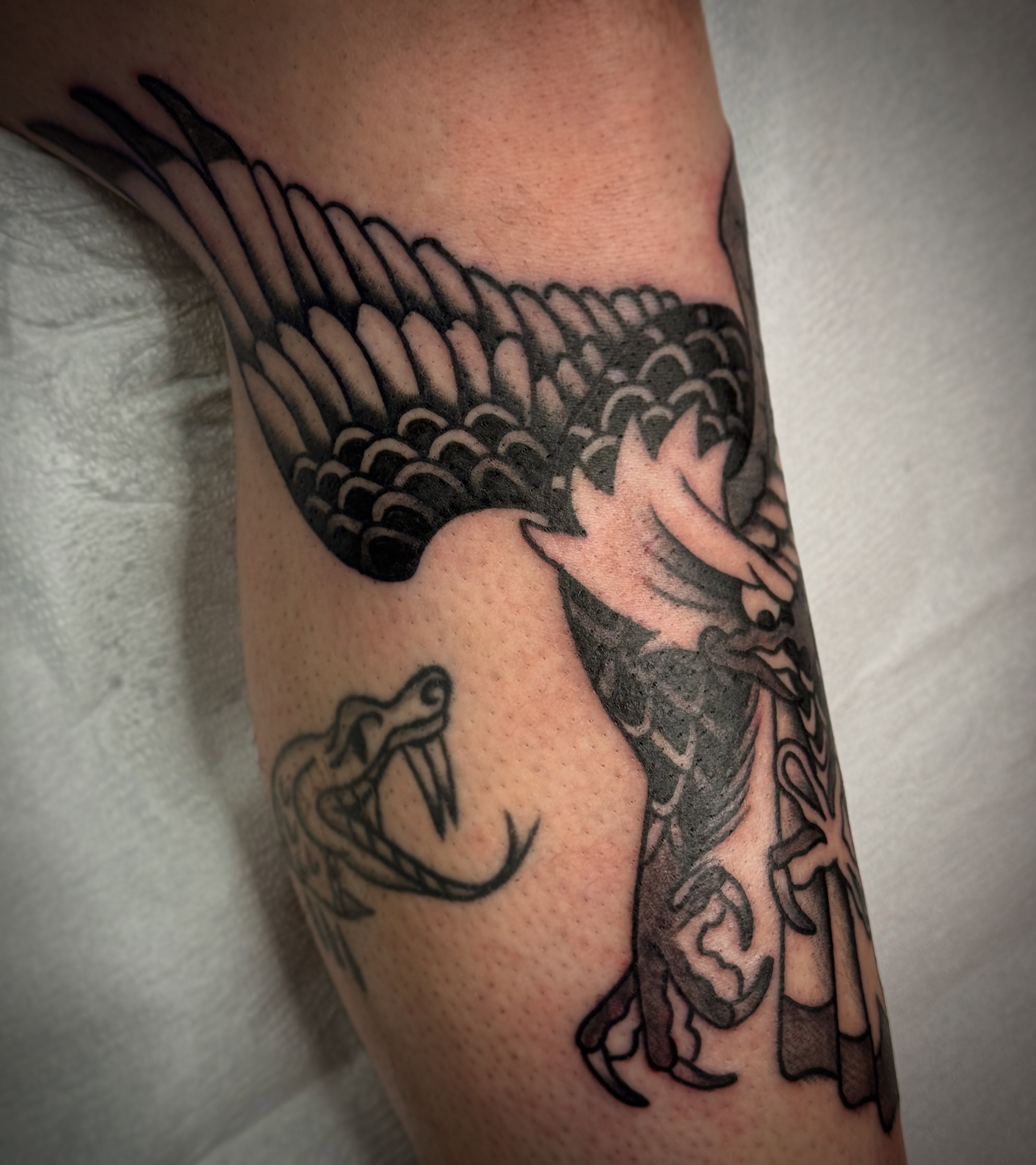 Bird and snake black and grey tattoo on the forearm by 🕸curtis Fink🕸