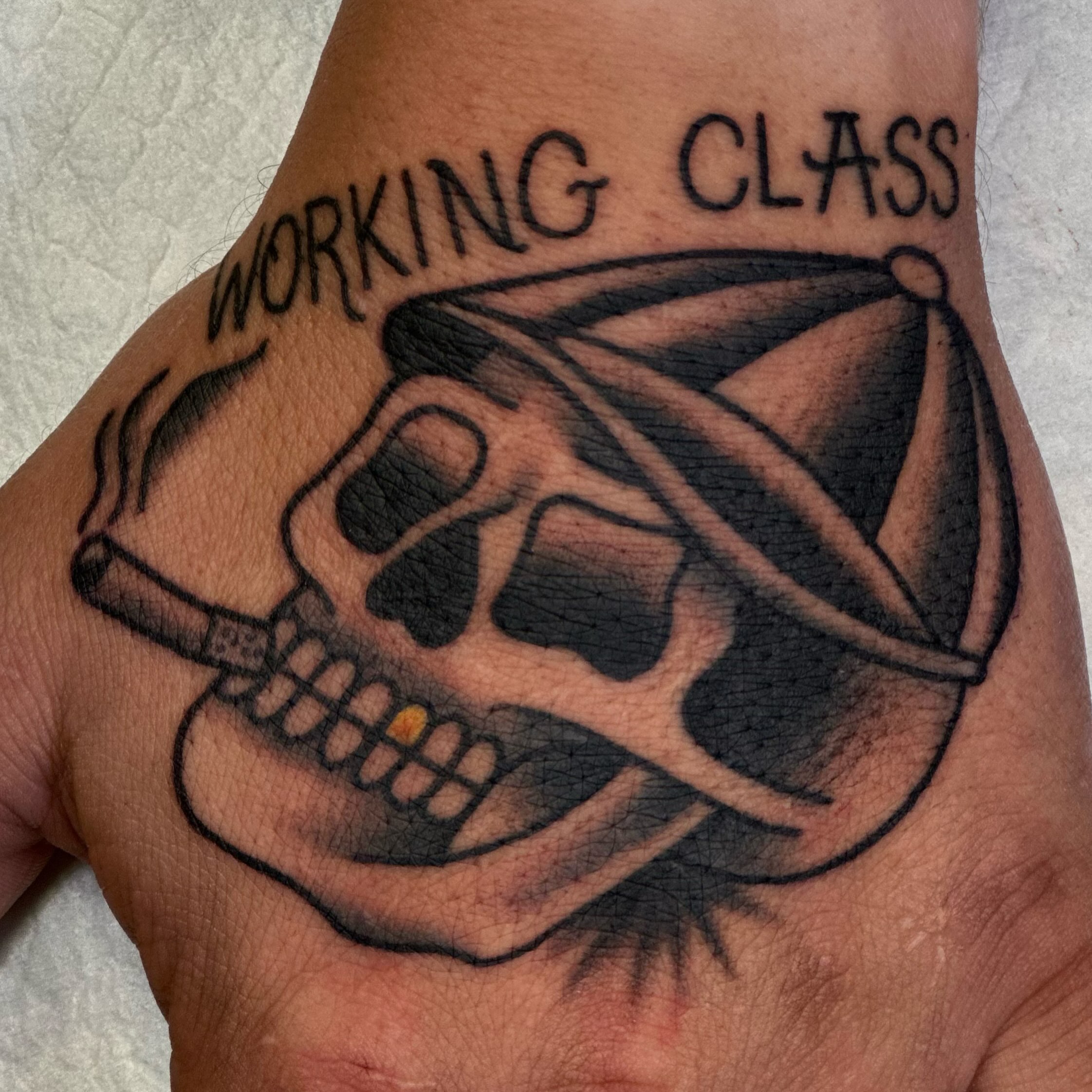 Skull with bandana American traditional tattoo on the forearm by Dylan Curry