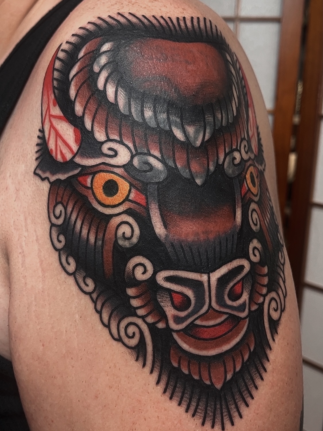 Mask American traditional tattoo on the shoulder by Las Vegas Tattoo Artist