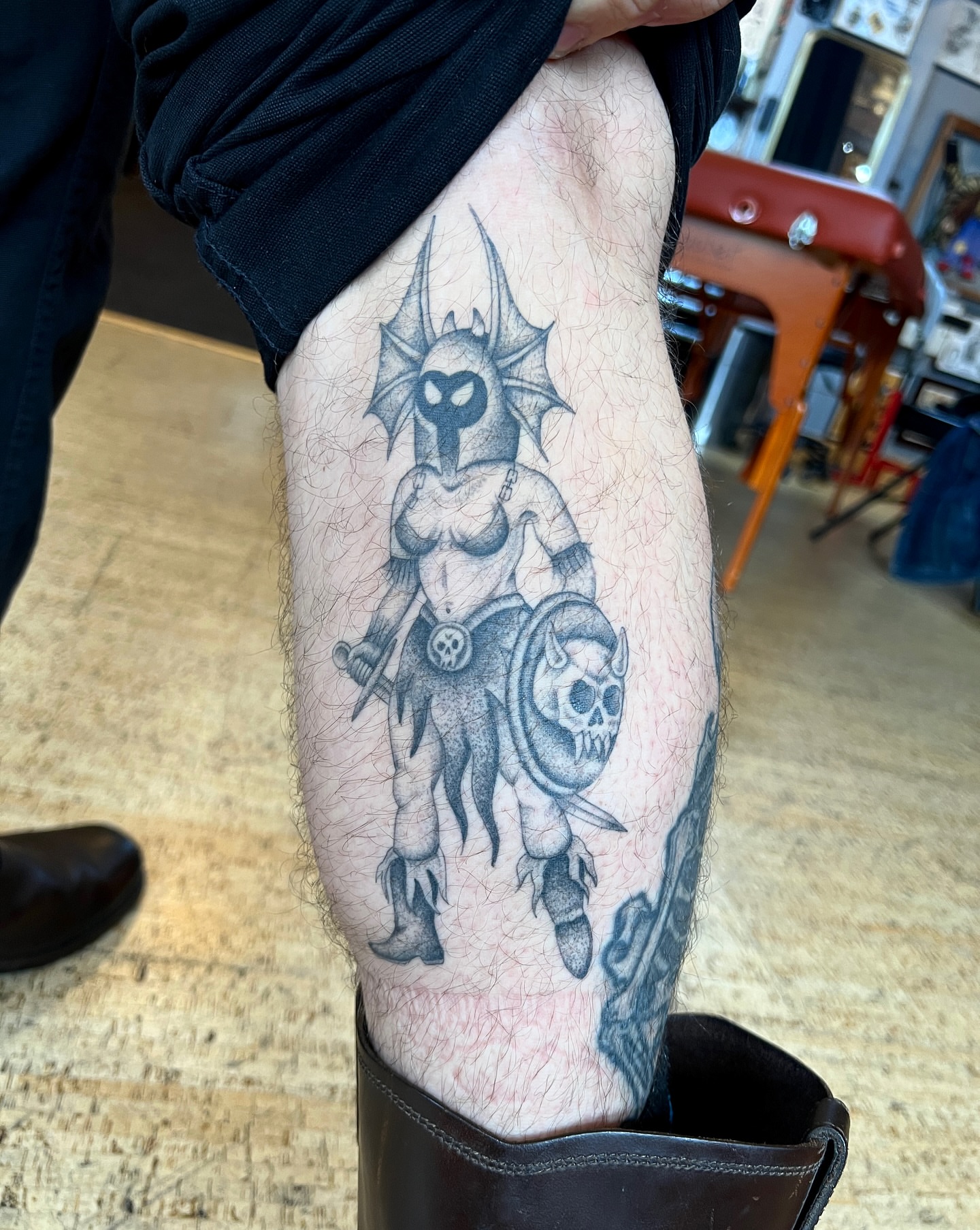 Female warrior black and grey tattoo on the thigh by David Delacruz