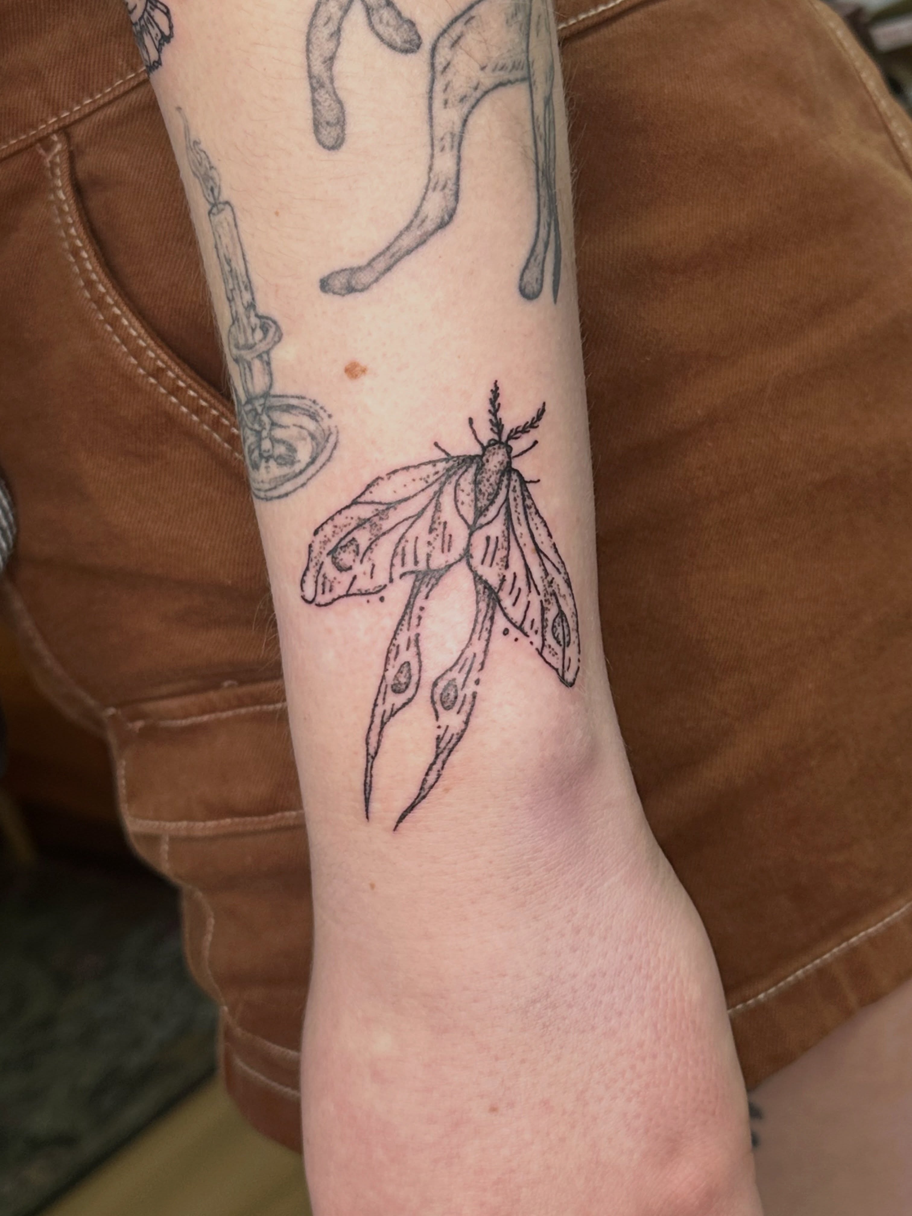 Moth black and grey tattoo on the forearm by Fleur ๐ฅ