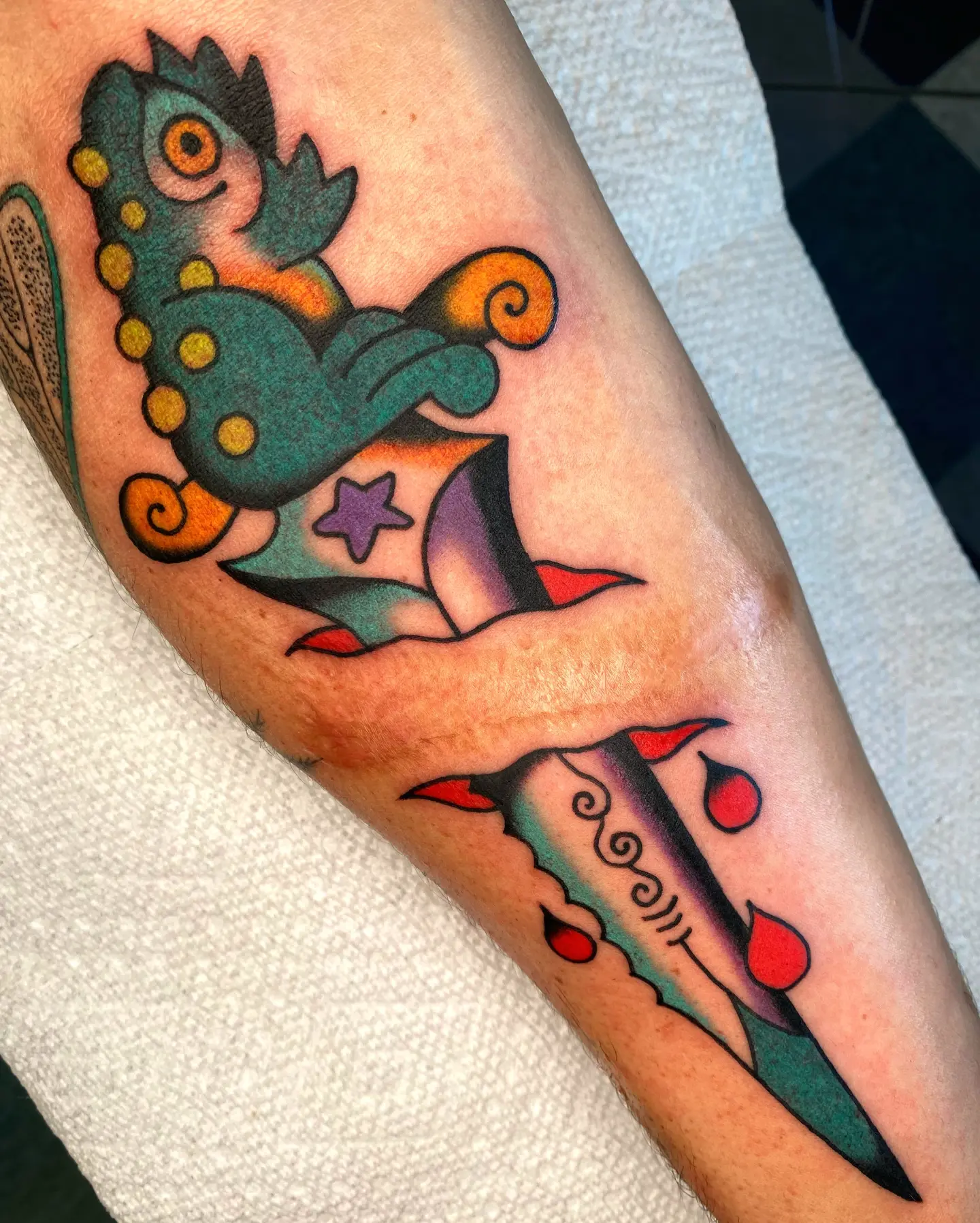 Seahorse and rocket American traditional tattoo on the forearm by Quinn, Kansas City, Missouri