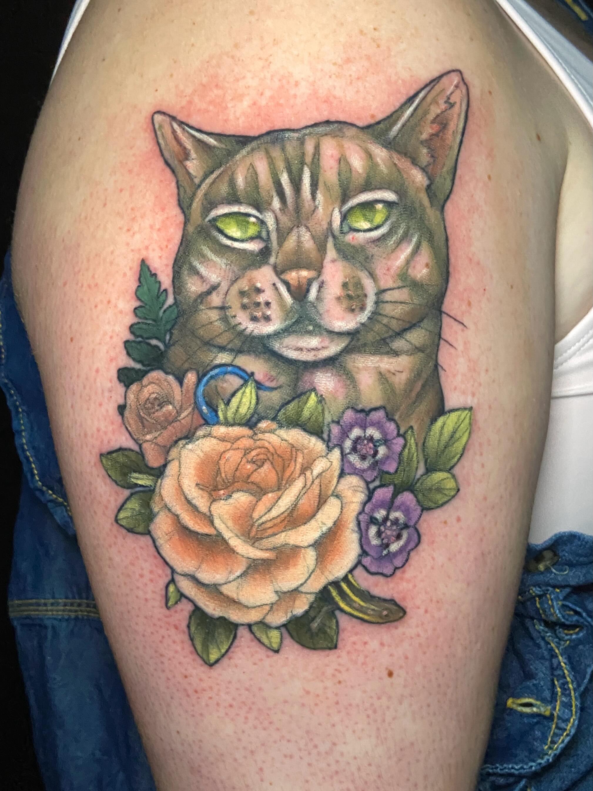 Cat and flowers realism tattoo on the thigh by Dawn Carr, Richmond, Virginia