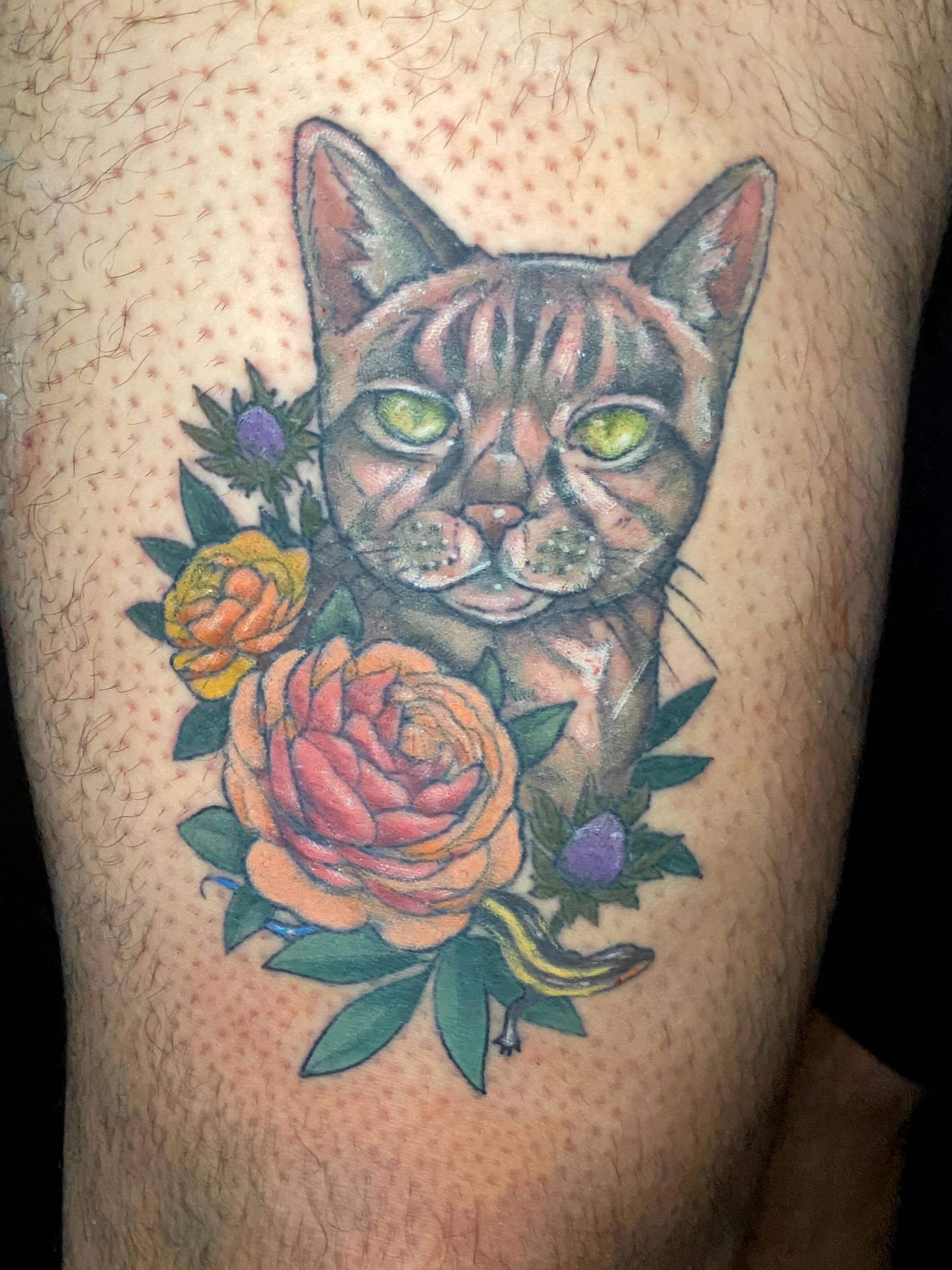 Cat and flowers American traditional tattoo on the thigh by Dawn Carr, Richmond, Virginia