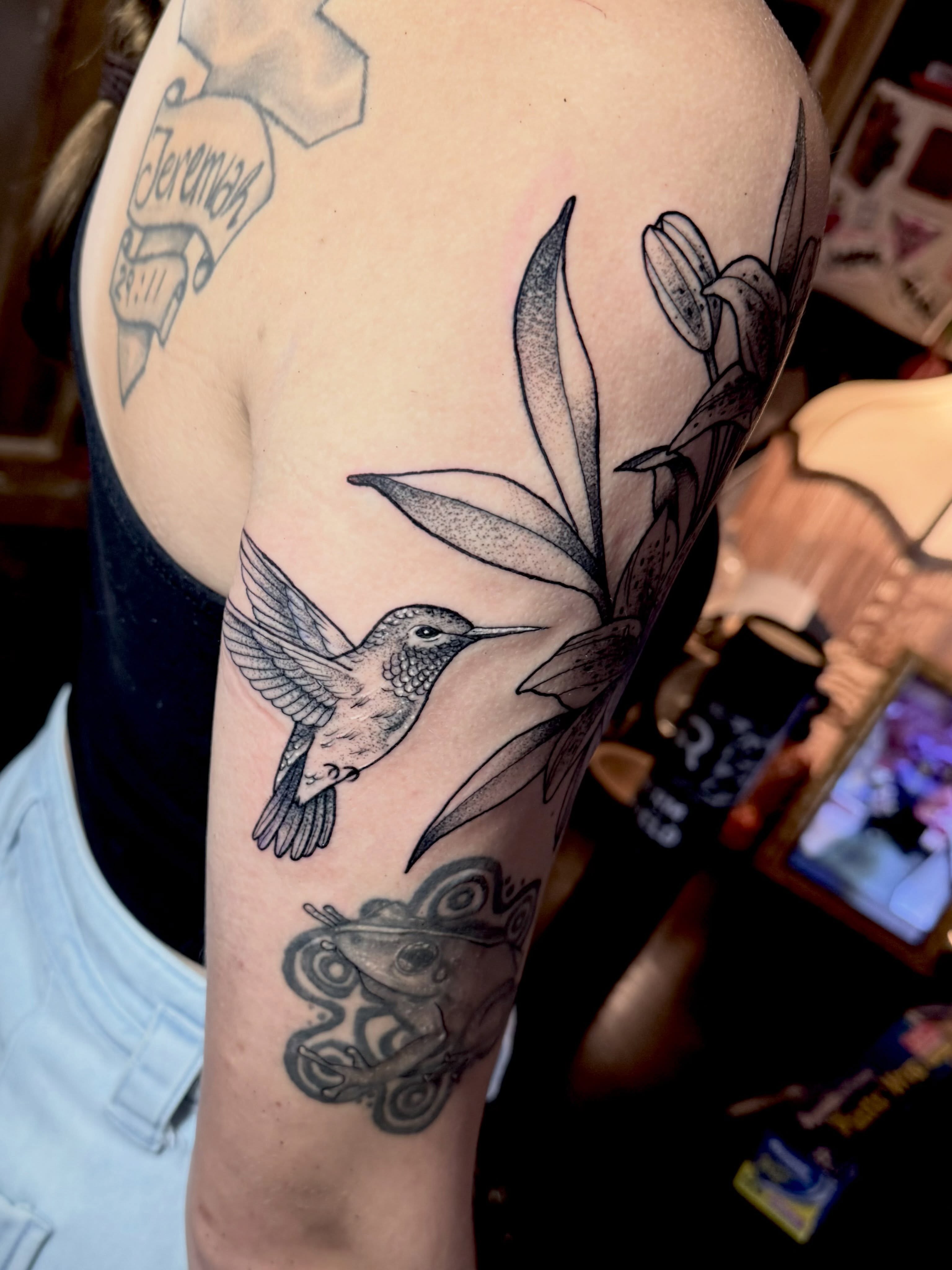 Hummingbird and orchid dotwork tattoo on the forearm by Emily Emani, Fremont, Ohio