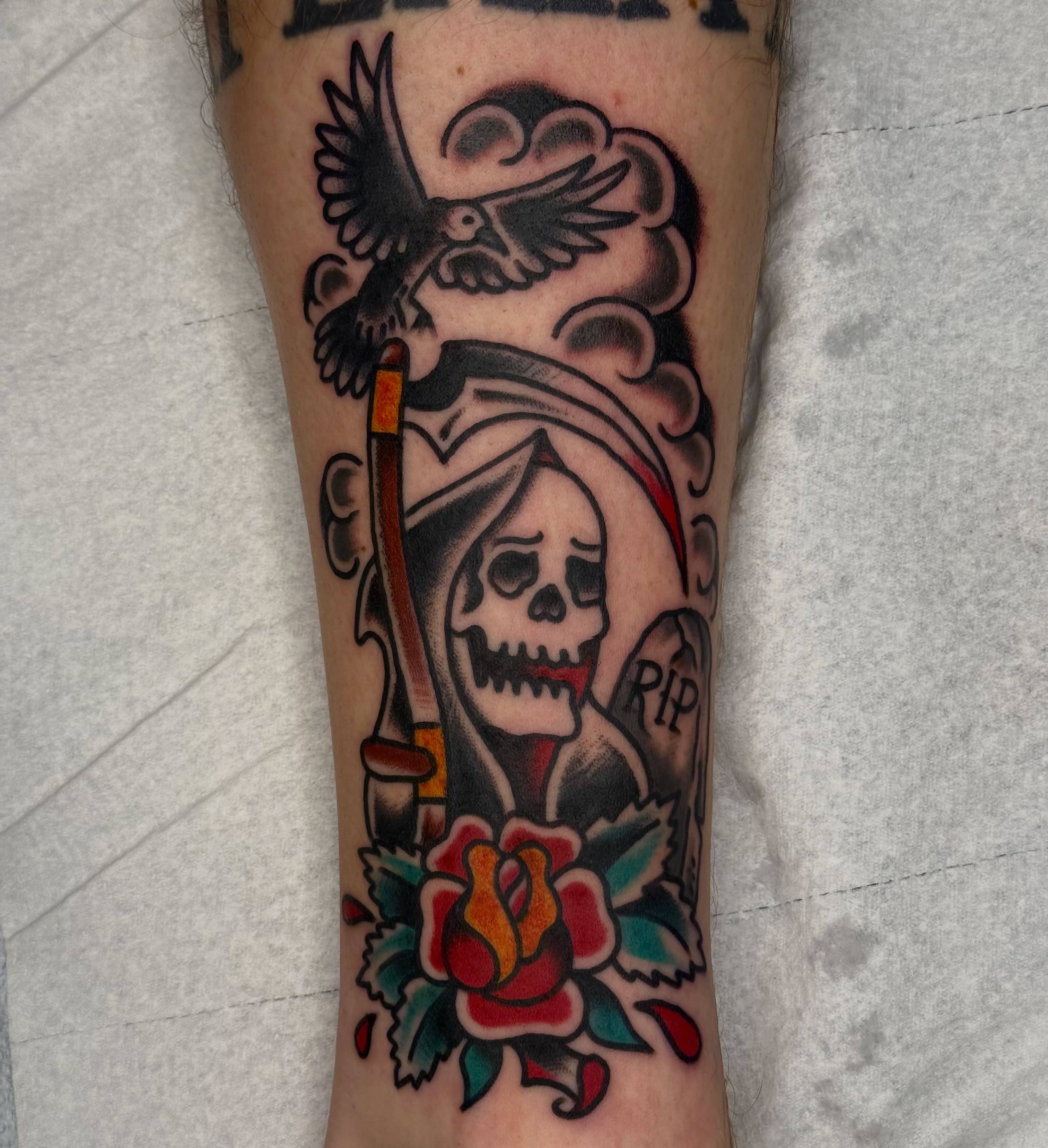Reaper and rose American traditional tattoo on the forearm by Clayton - TRADITIONAL TATTOOS