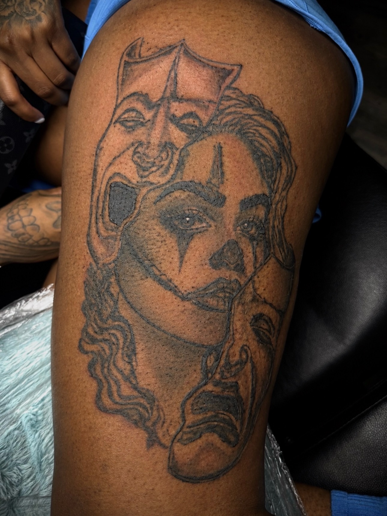 Woman's face black and grey tattoo on the thigh by Left My Mark