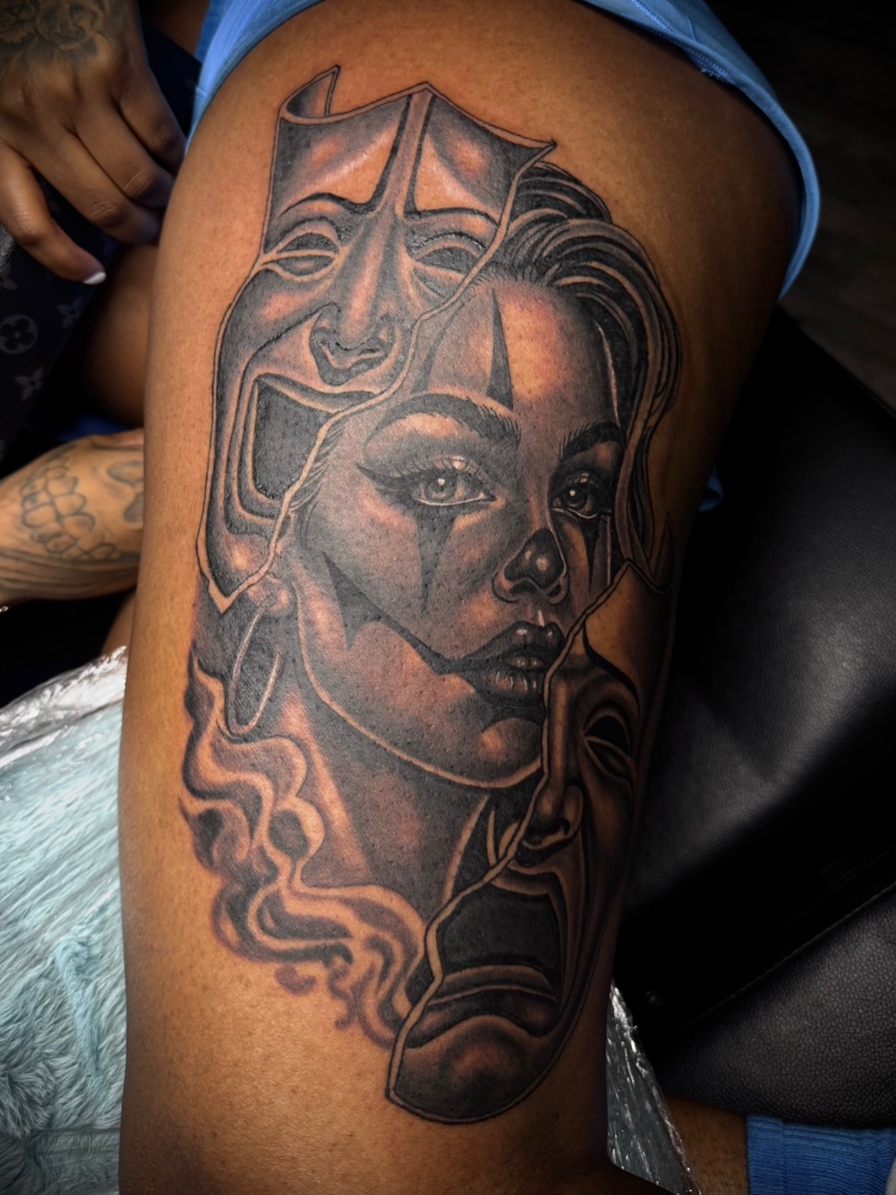 Woman's face realism tattoo on the thigh by Left My Mark