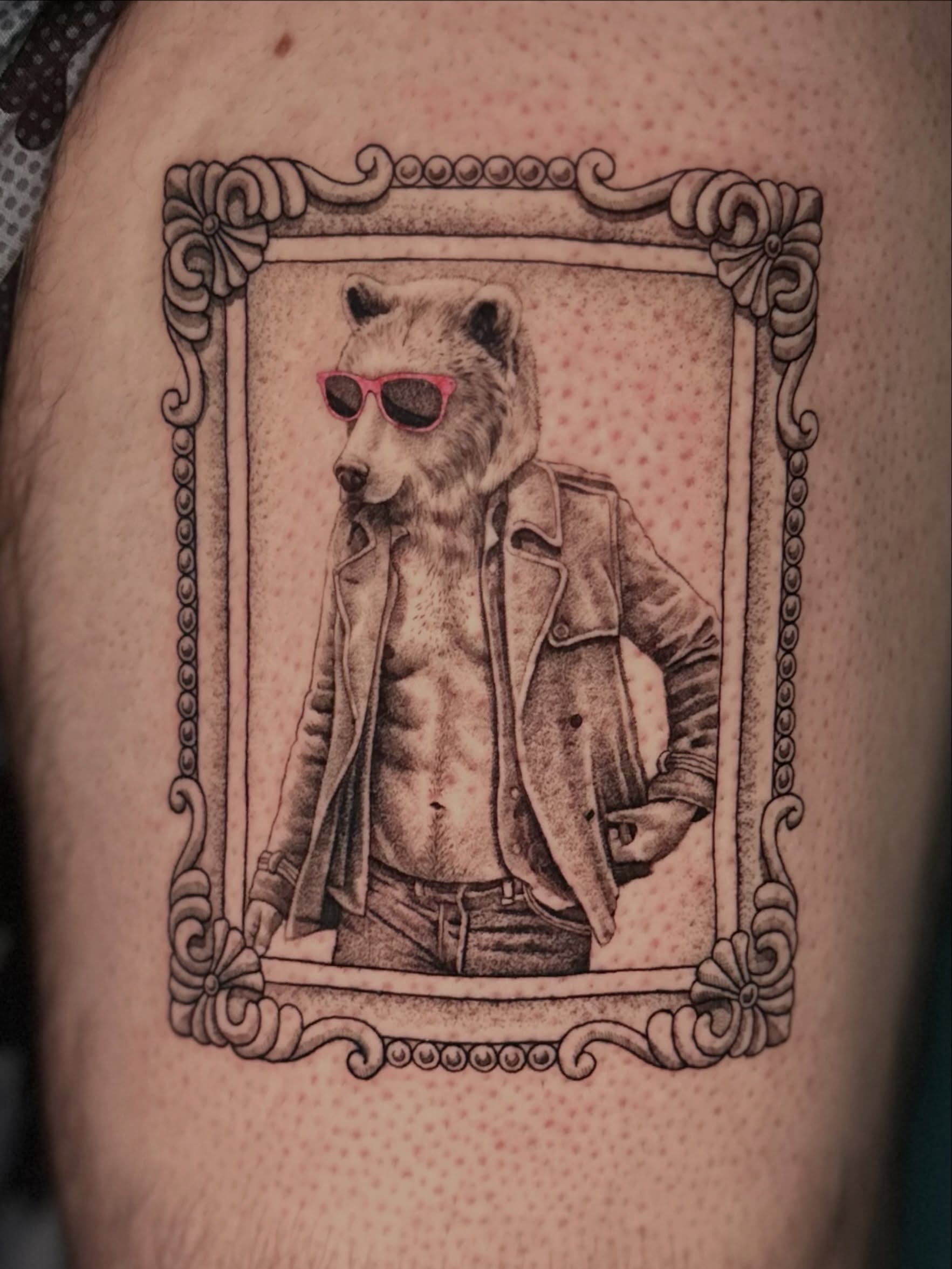 Bear wearing sunglasses realism tattoo on the thigh by Ghost