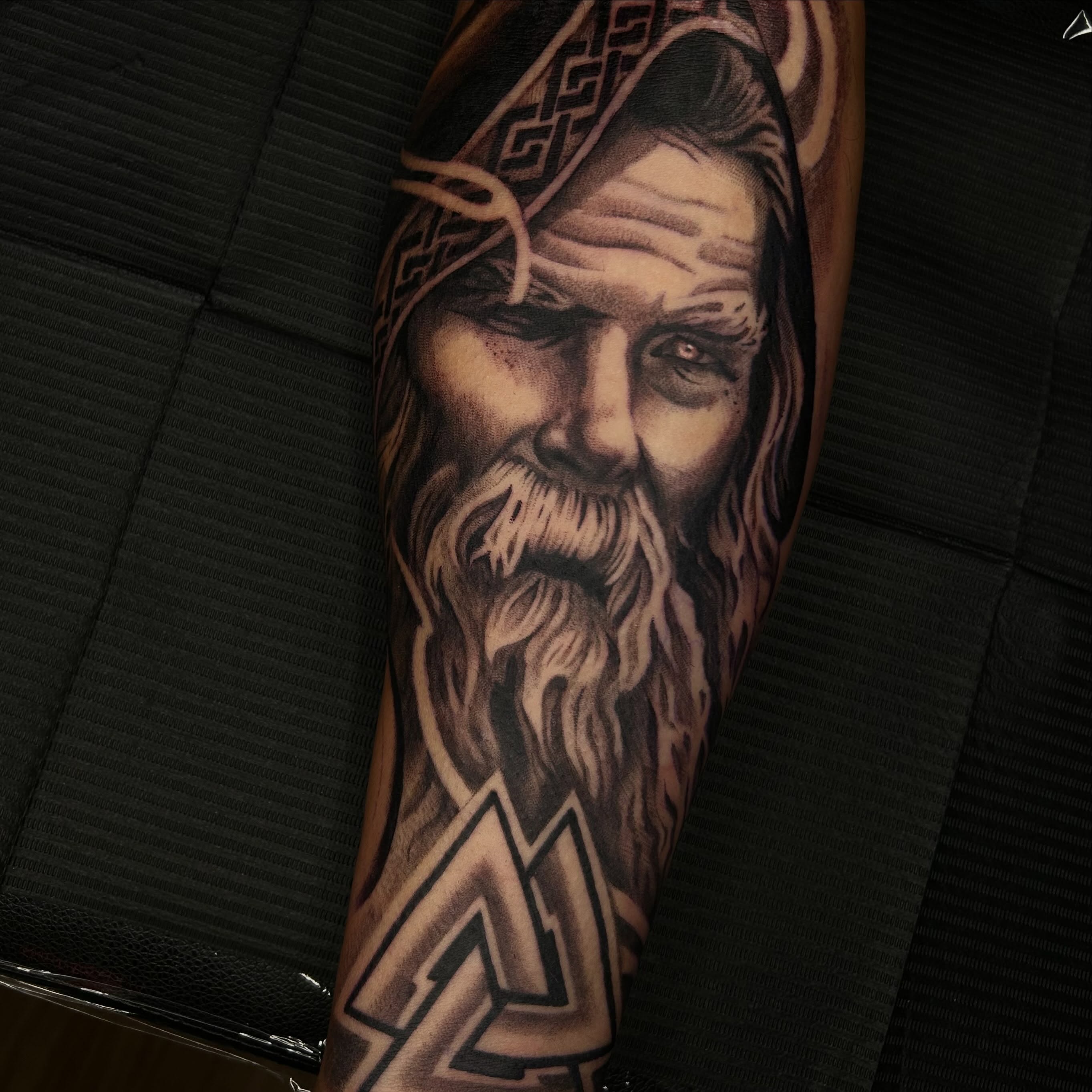 Bearded man realism tattoo on the forearm by Whitney Harbin