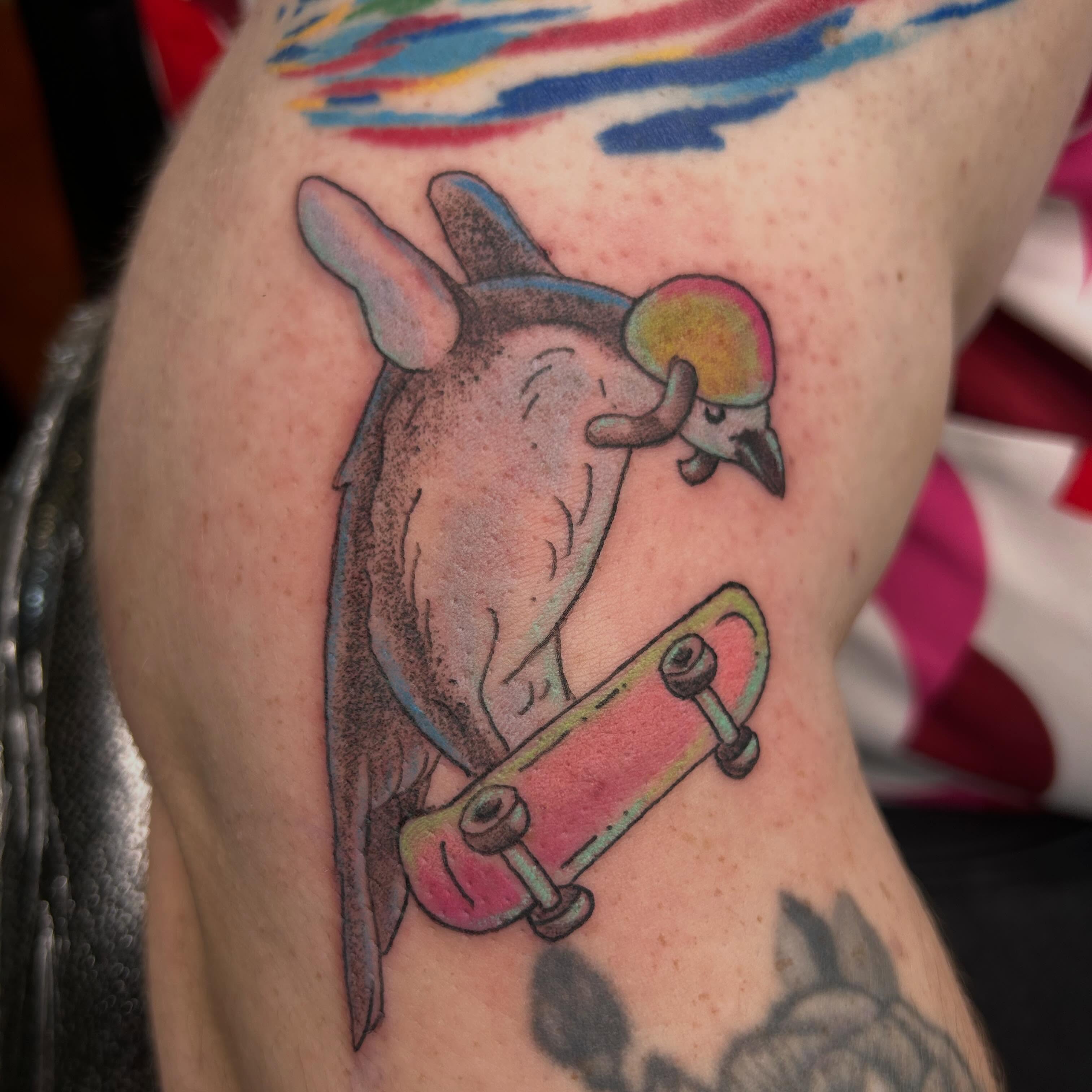 Bat on skateboard new school tattoo on the forearm by Reilley Earles
