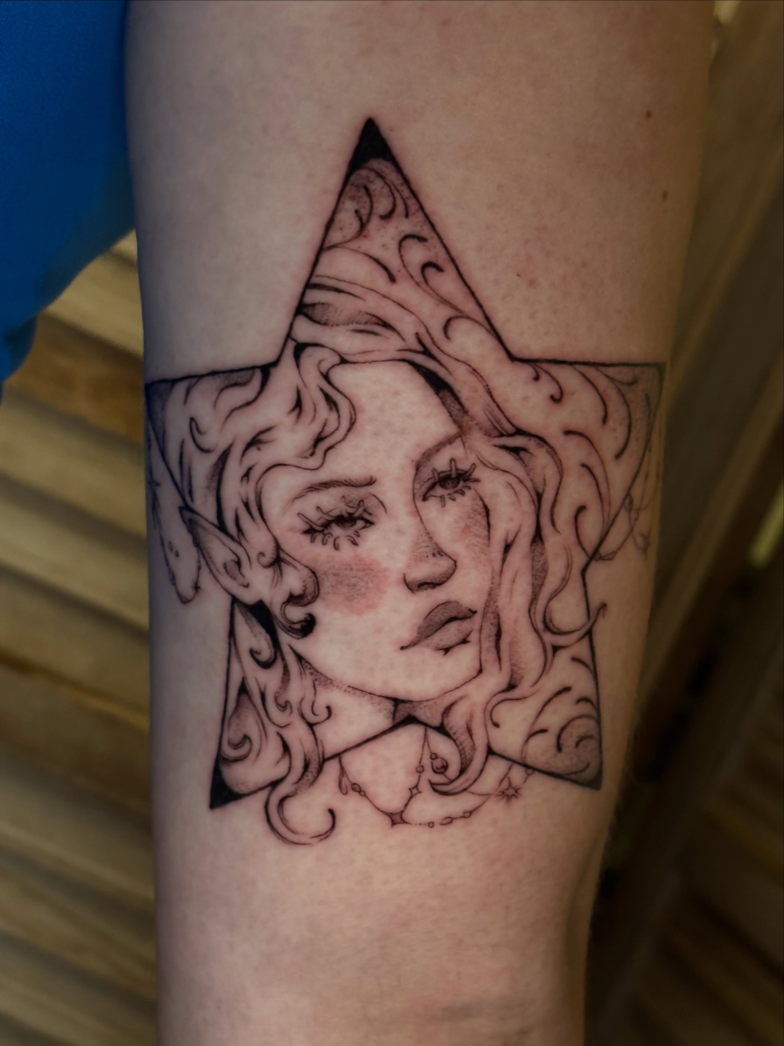 Woman's face black and grey tattoo on the forearm by Chloe Shay