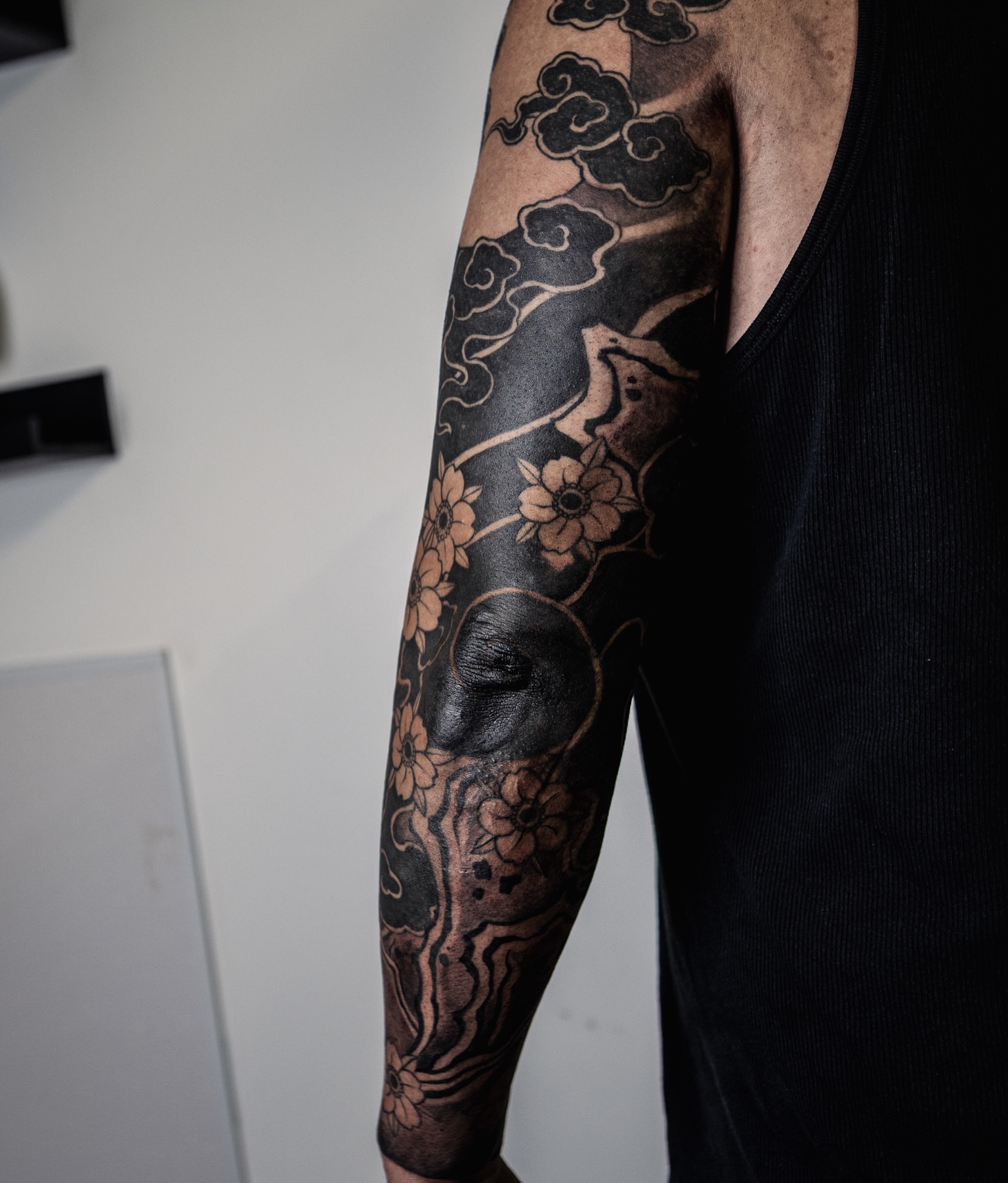 Clouds and flowers japanese irezumi tattoo on the forearm by Melissa "Lotuss" Chan