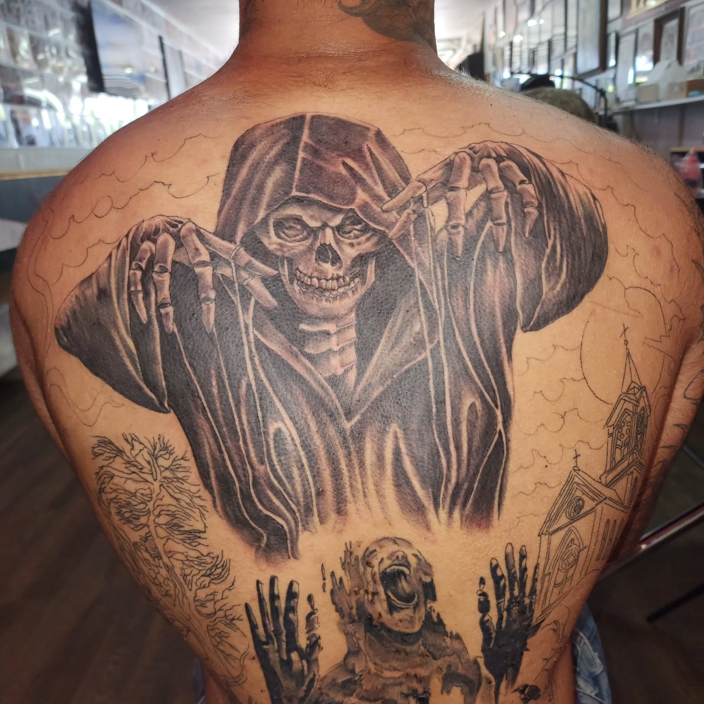 Grim reaper realism tattoo on the back by Joe Garcia