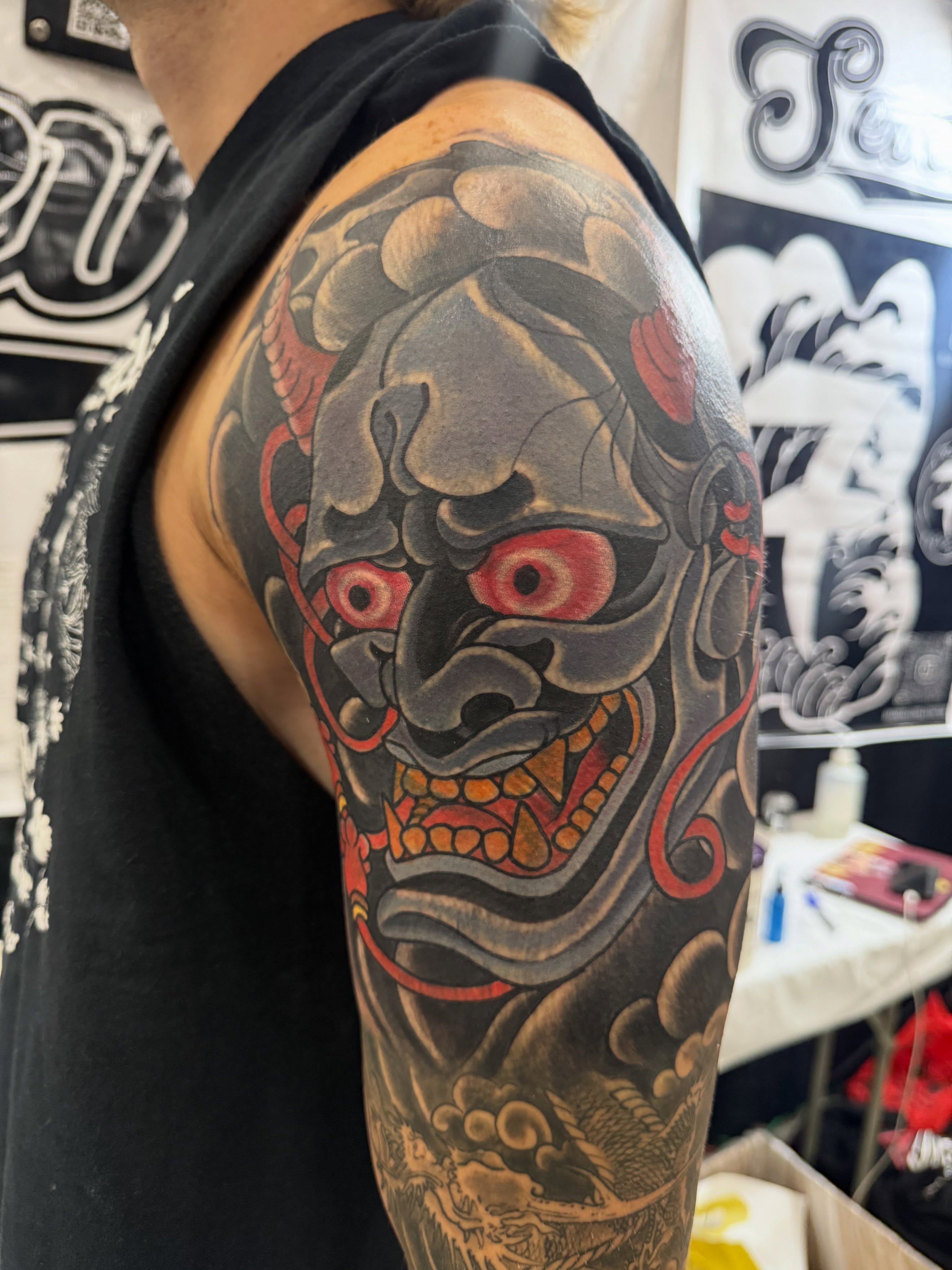 Demon mask japanese irezumi tattoo on the upper arm by Randall Croley El