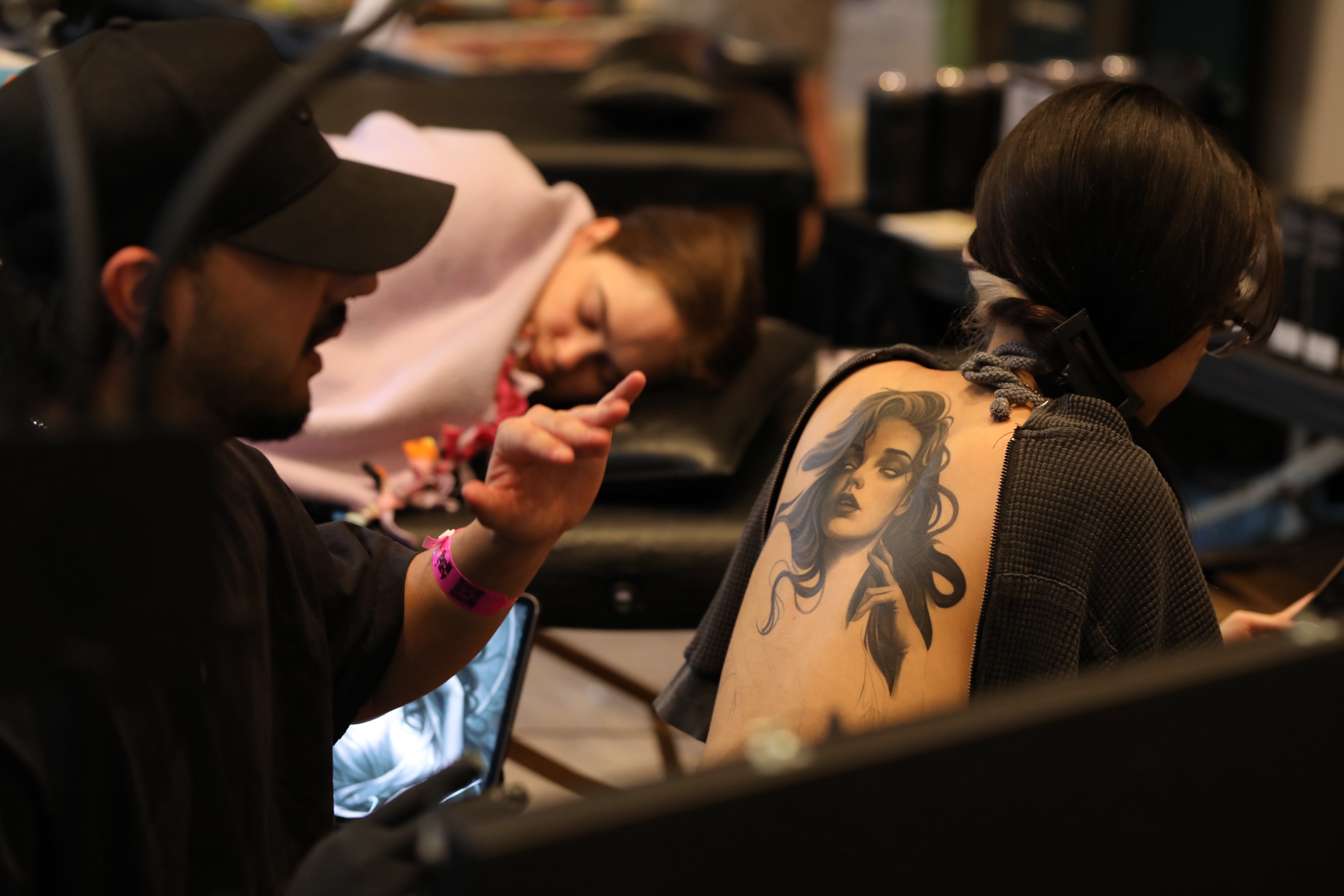 Woman with long hair realism tattoo on the shoulder by Durb