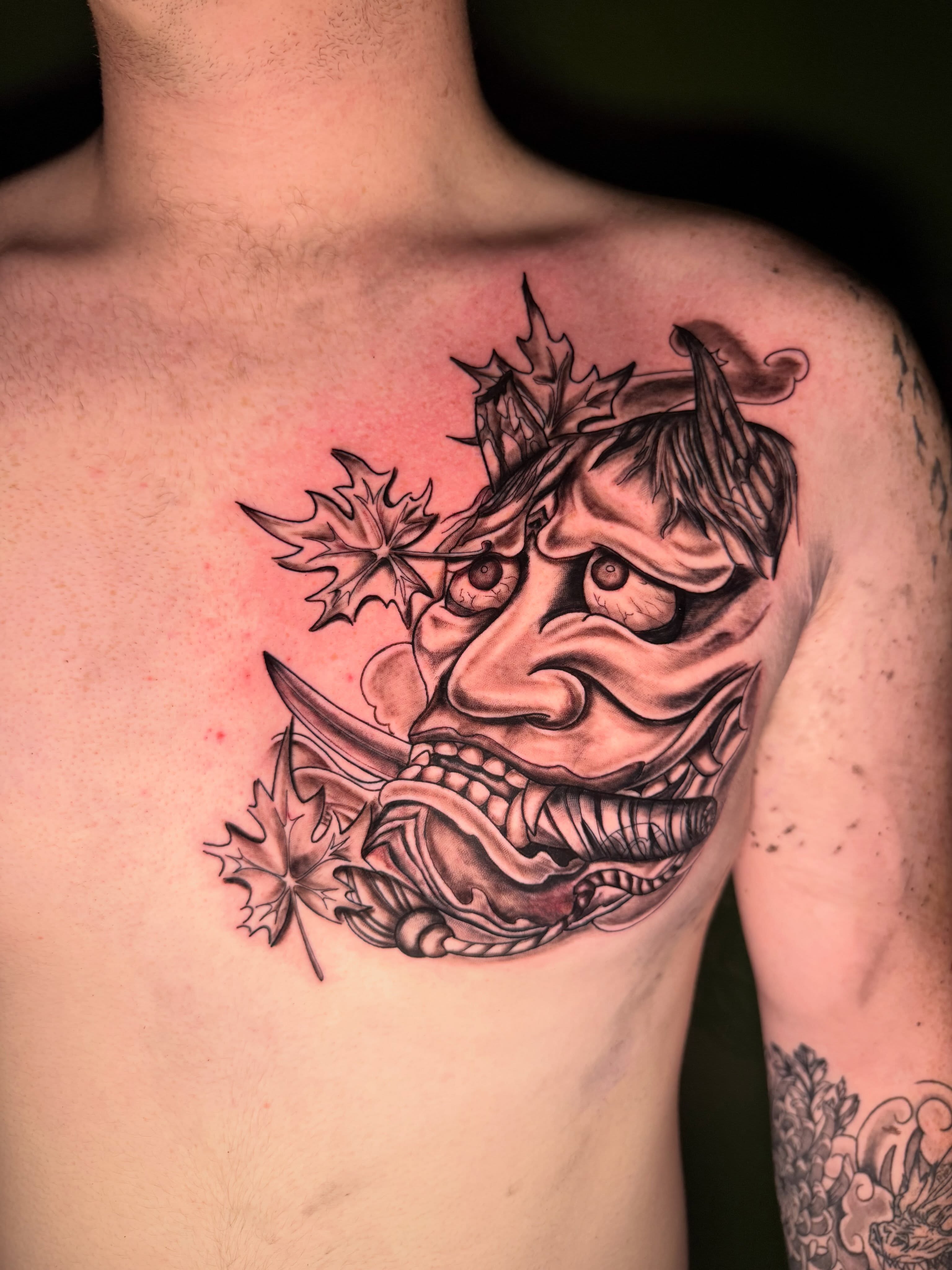 Demon mask realism tattoo on the chest by dotMX