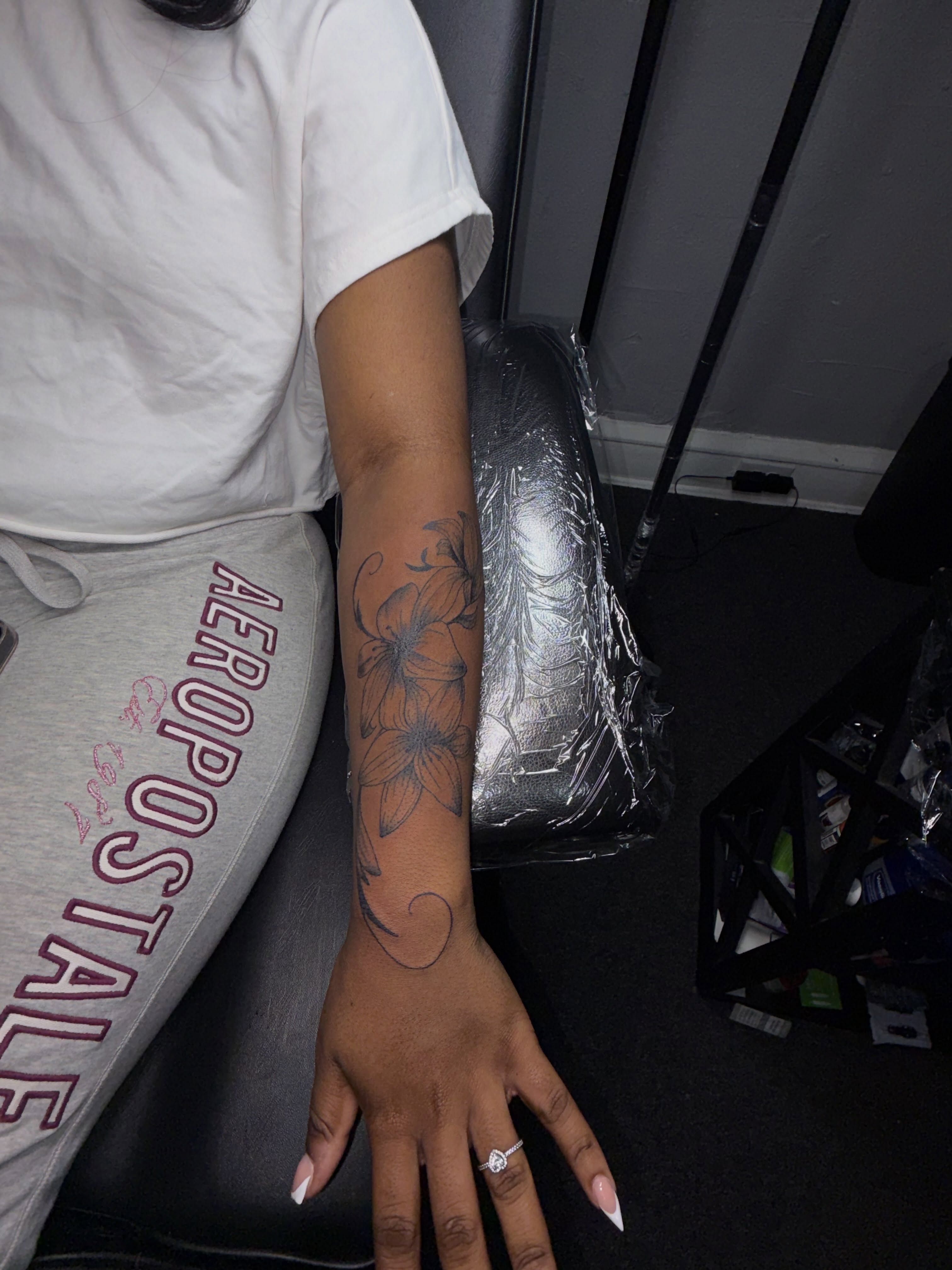 Floral design black and grey tattoo on the forearm by 216 Tattoos 🥰