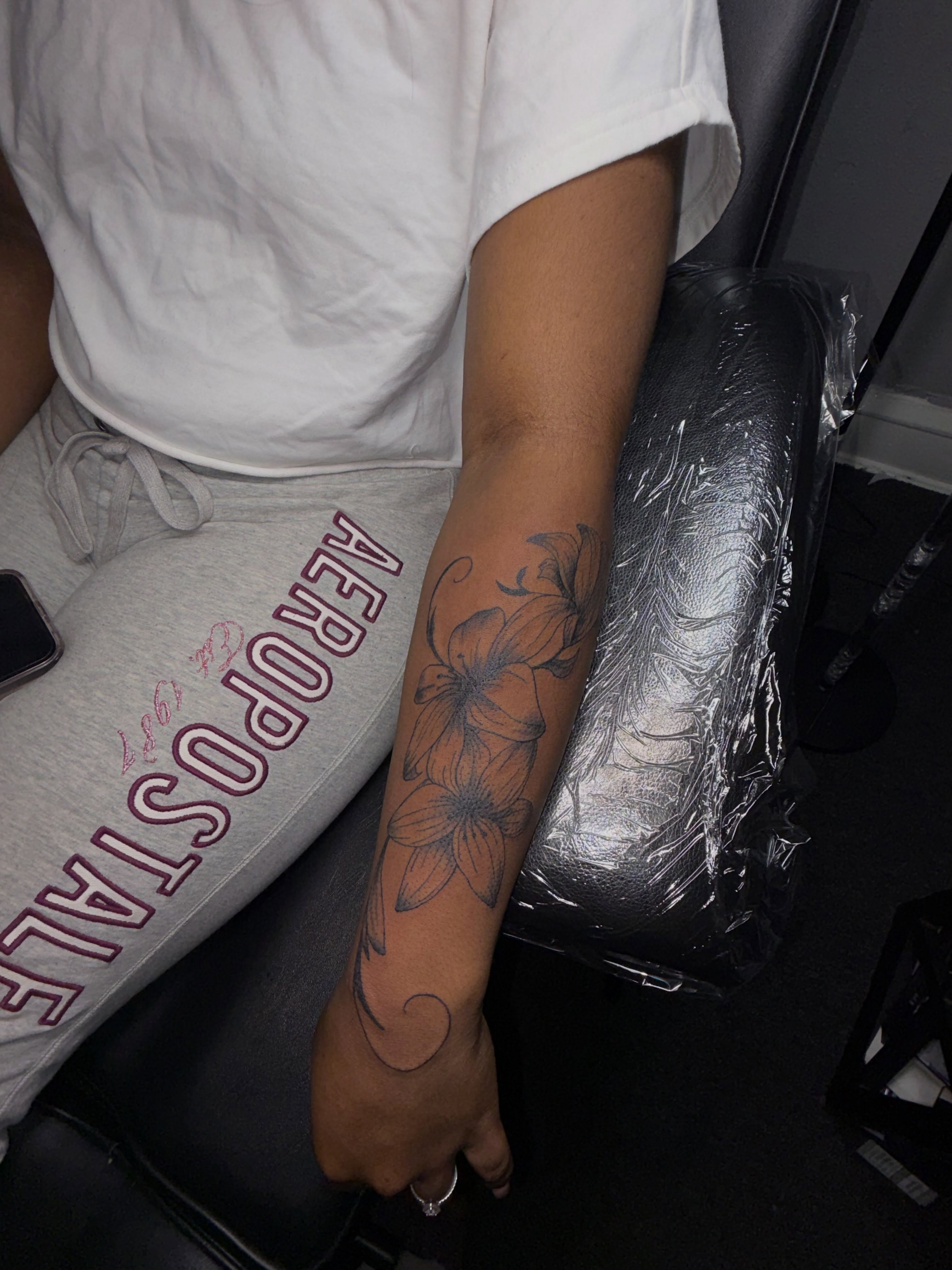 Flower black and grey tattoo on the forearm by 216 Tattoos 🥰