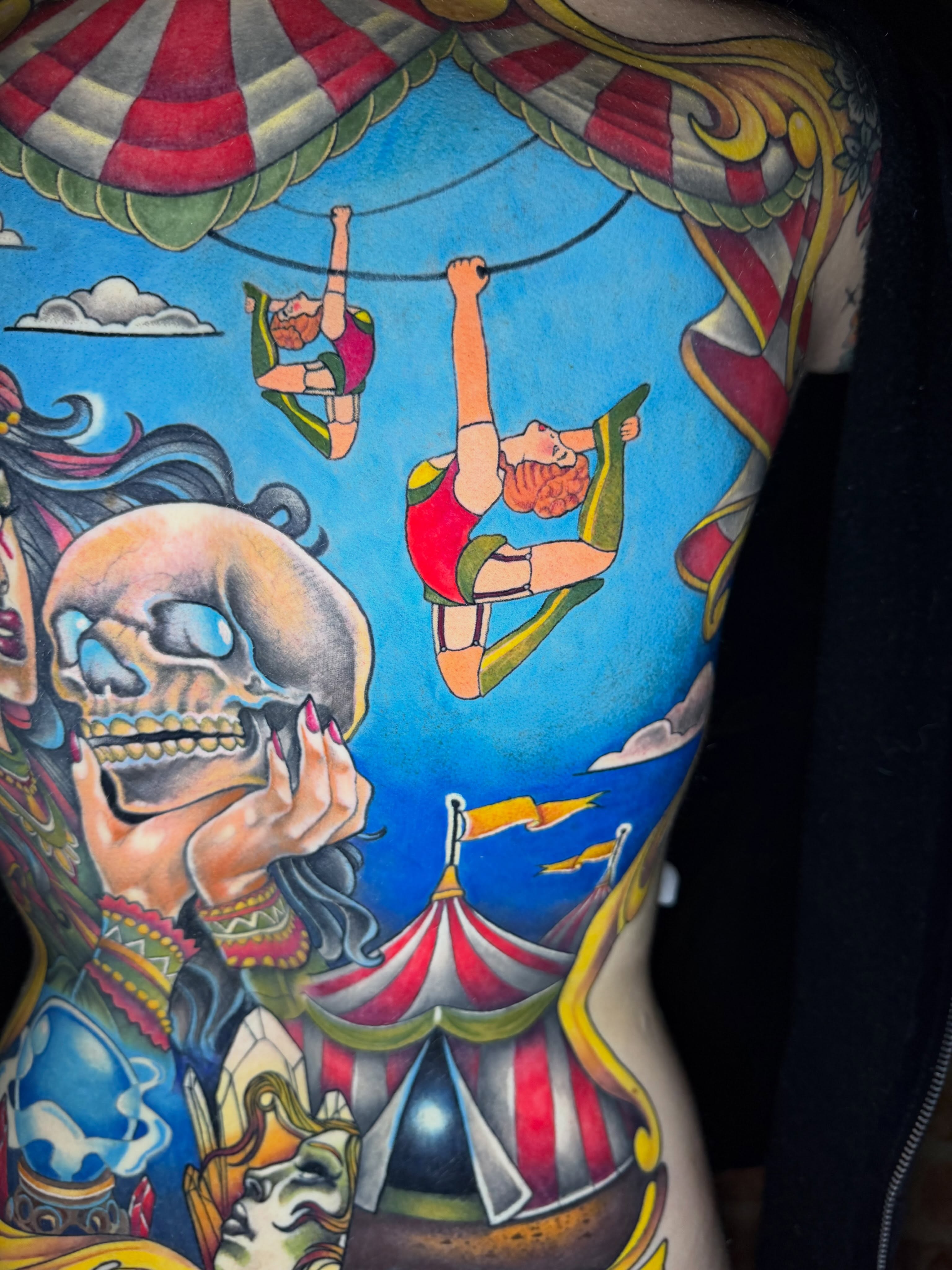 Circus performers American traditional tattoo on the back by Taylor Steckman