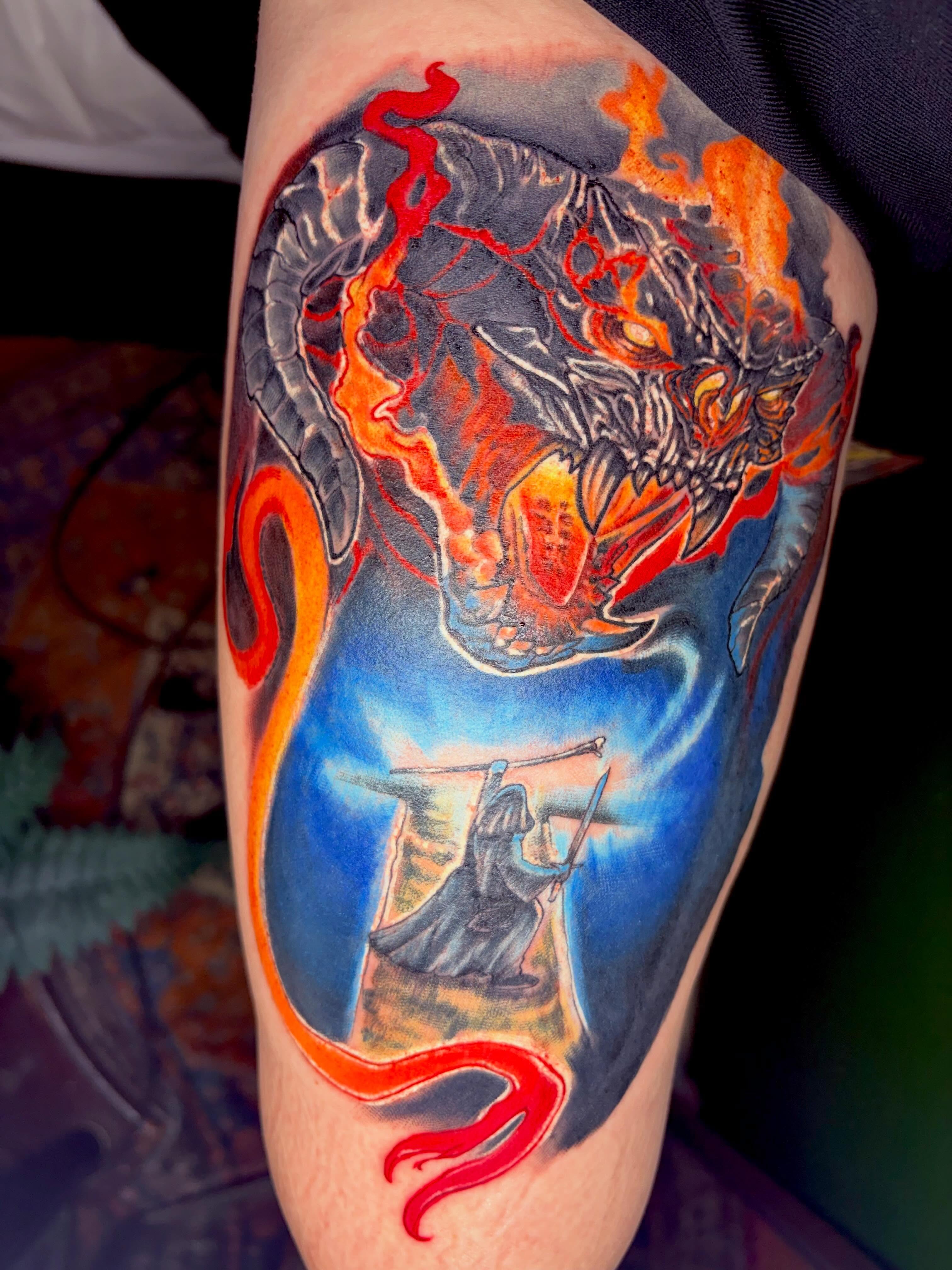 Dragon and warrior dotwork tattoo on the thigh by Aaron Ysidro