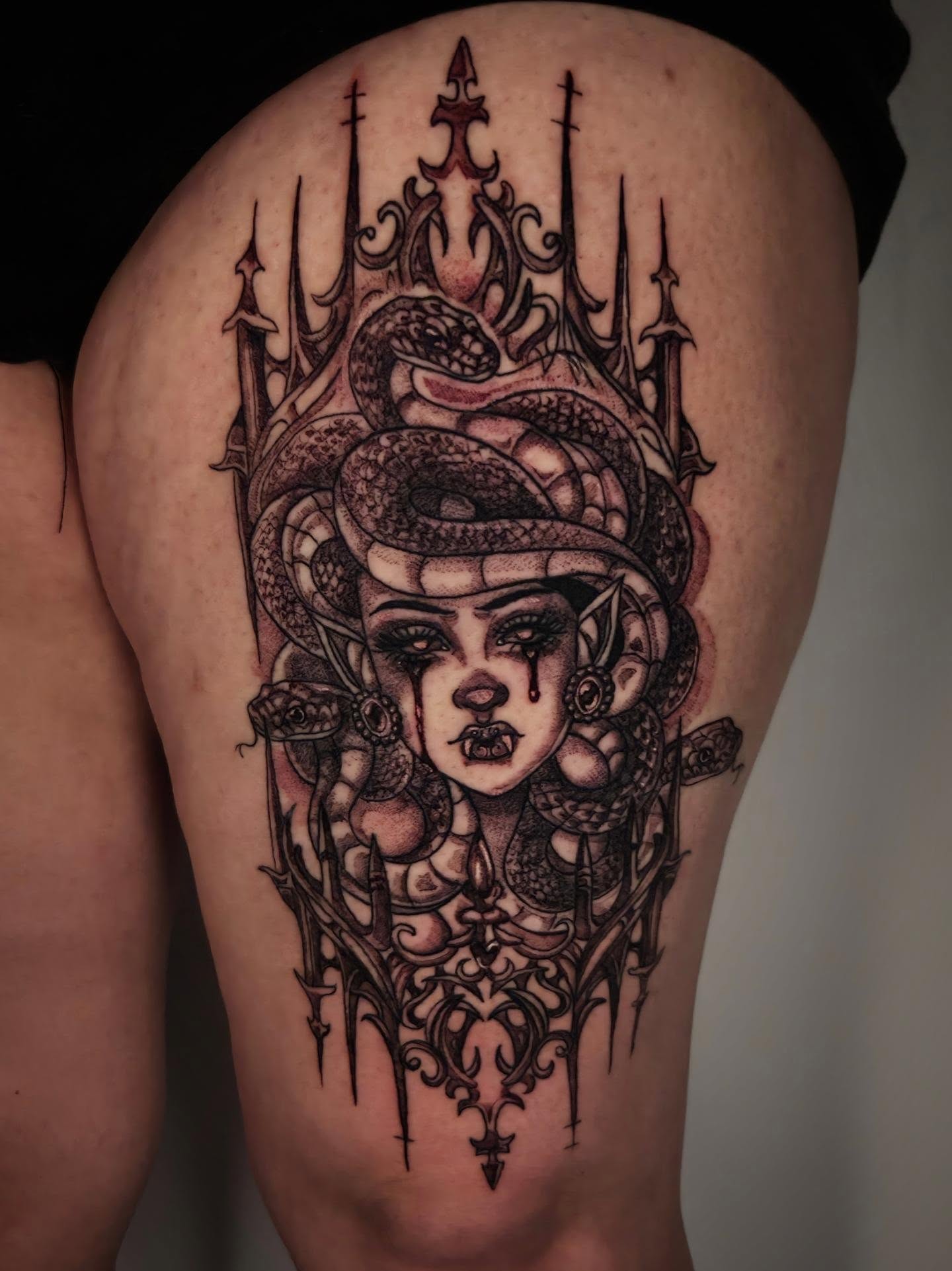 Woman with snakes dark realism tattoo on the thigh by Devin 🖤