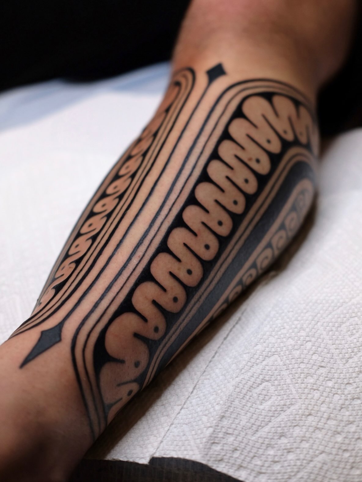 Tribal pattern tribal tattoo on the forearm by Owlyn Madrone