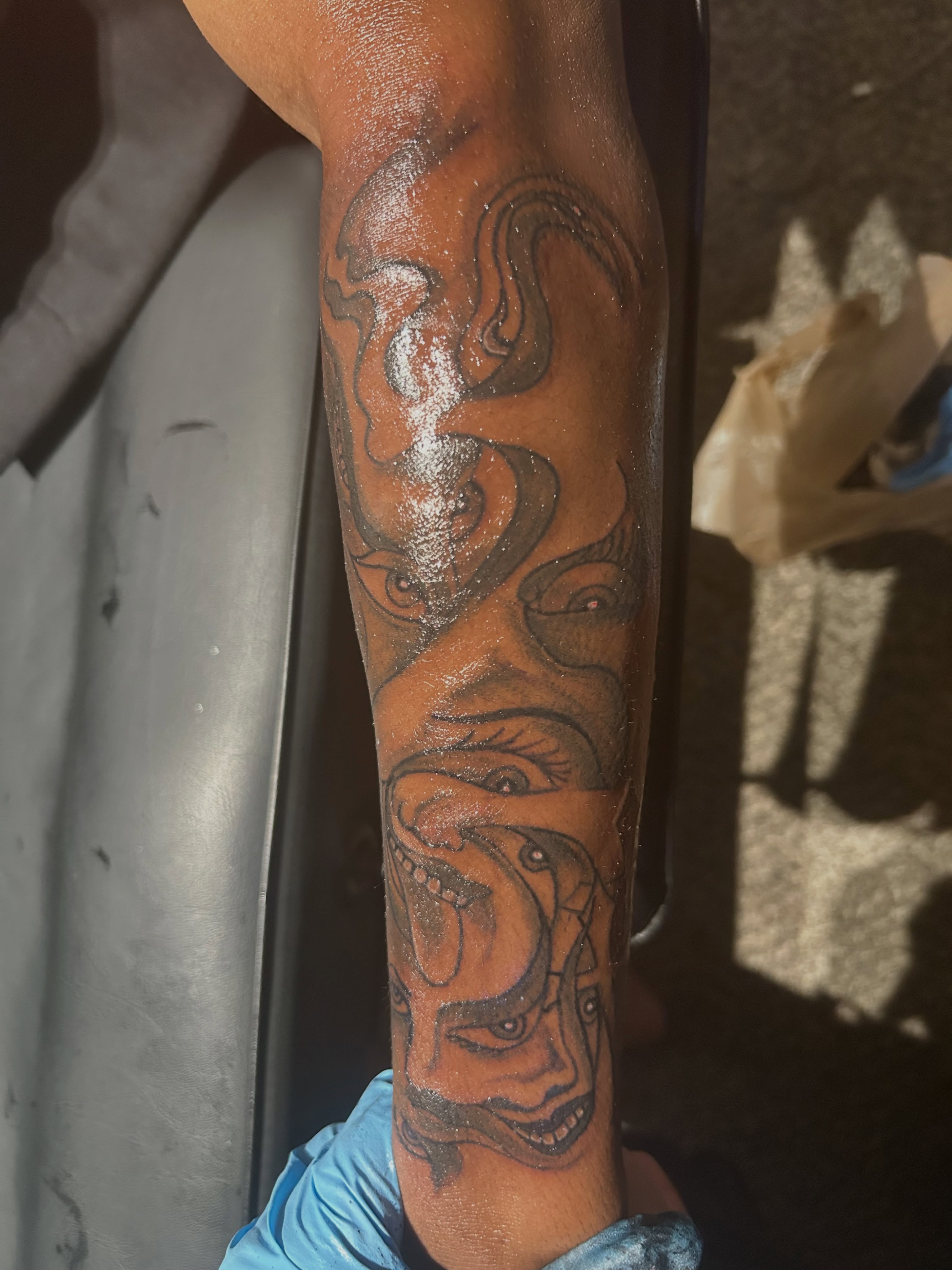 Demon face dark realism tattoo on the forearm by @tatzbythadon