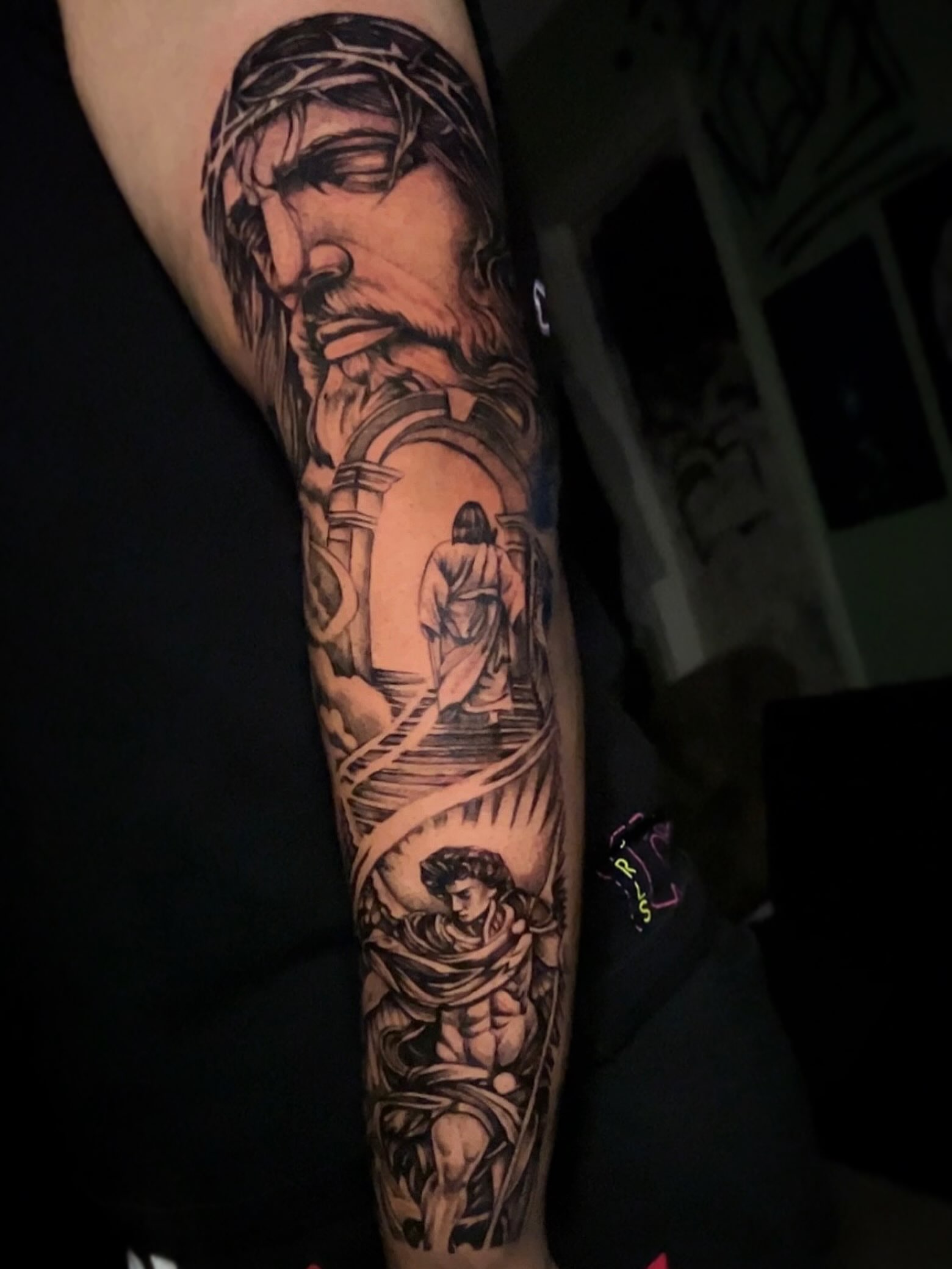 Religious scene realism tattoo on the forearm by Marky