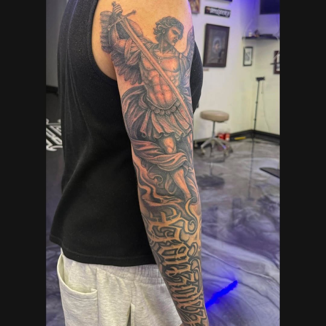 Angel with sword realism tattoo on the upper arm by @nickysix86