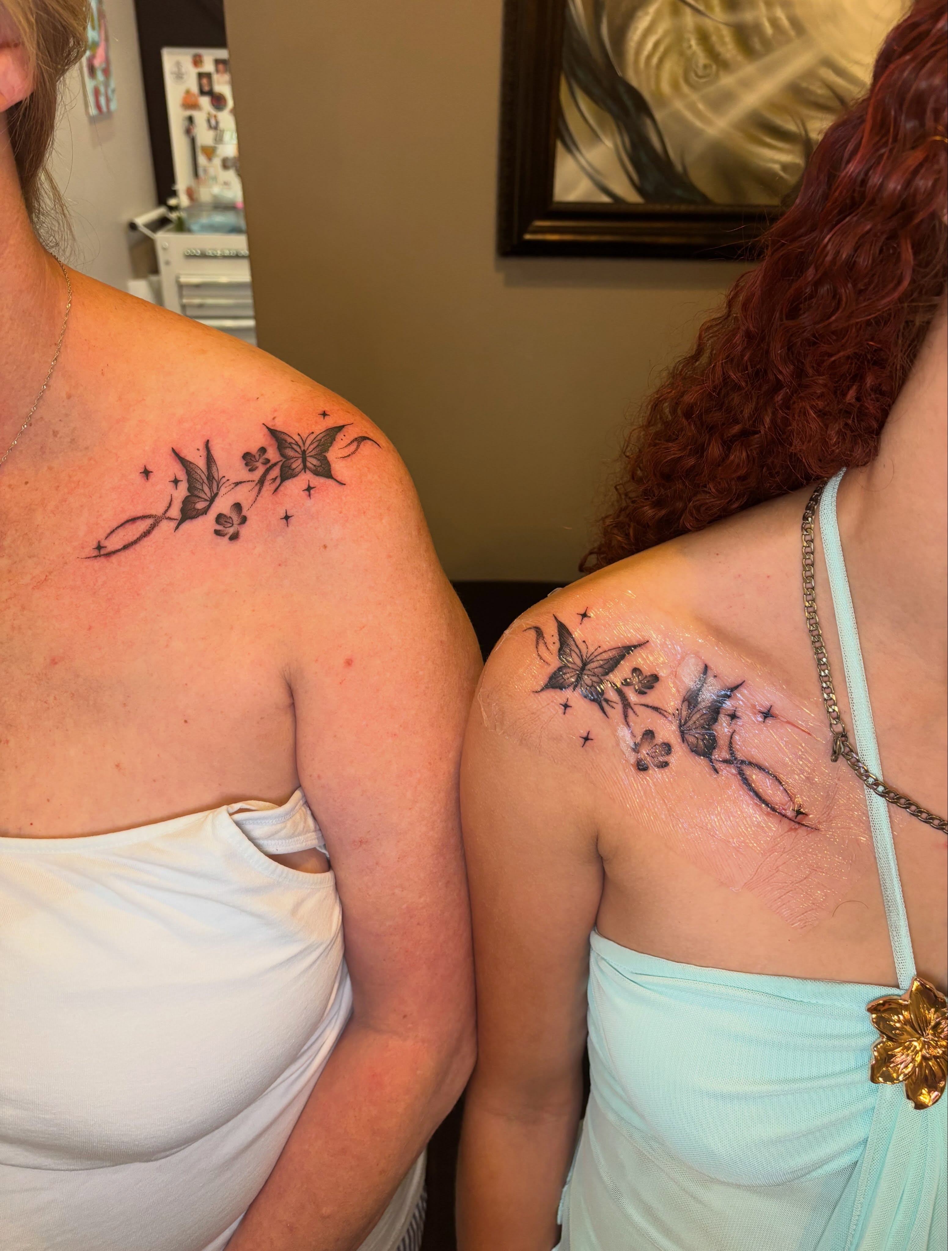 Butterflies and flowers black and grey tattoo on the shoulder by Aubri Aunna
