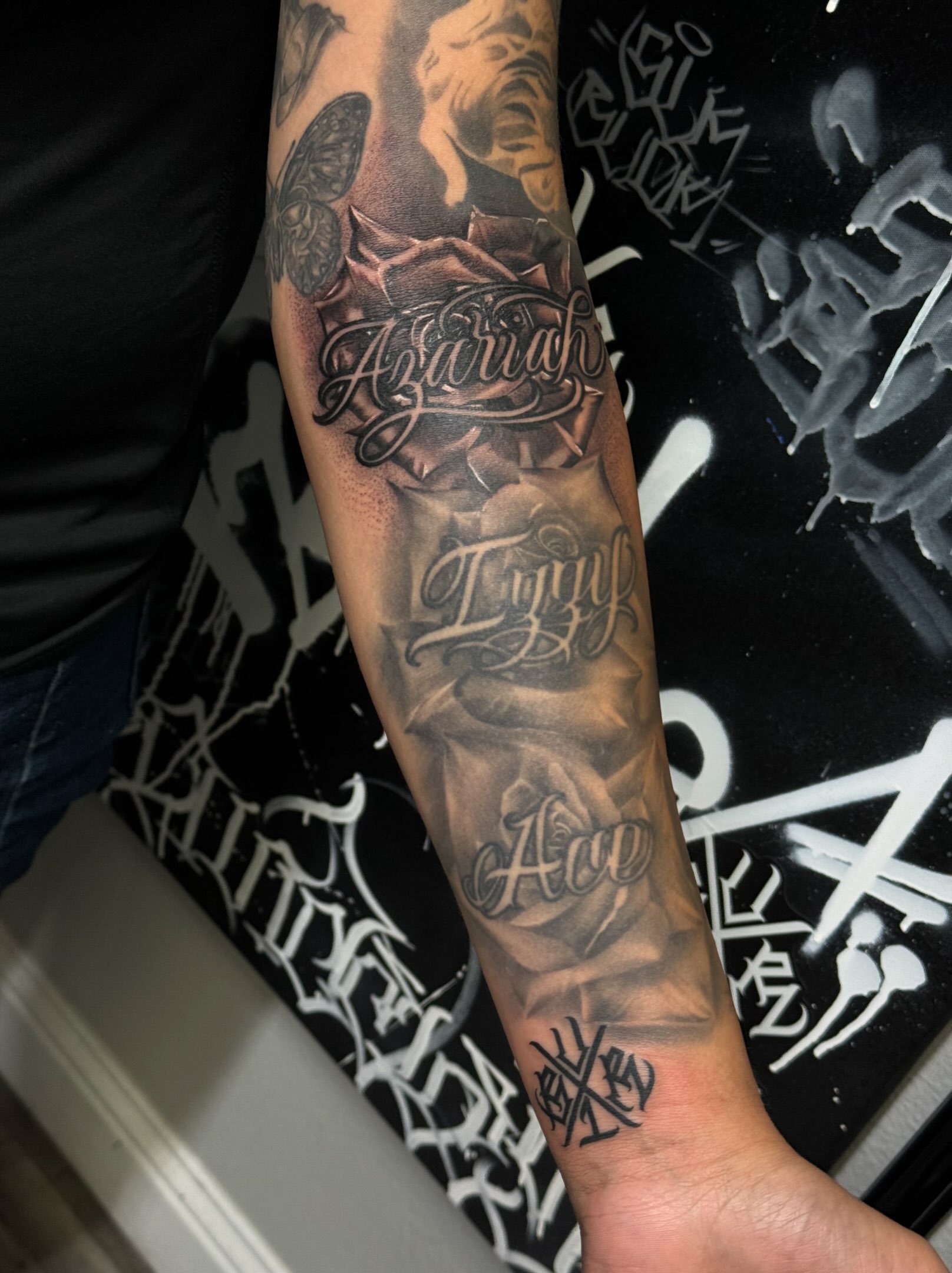 Rose and script realism tattoo on the forearm by El Beaver Tattoos