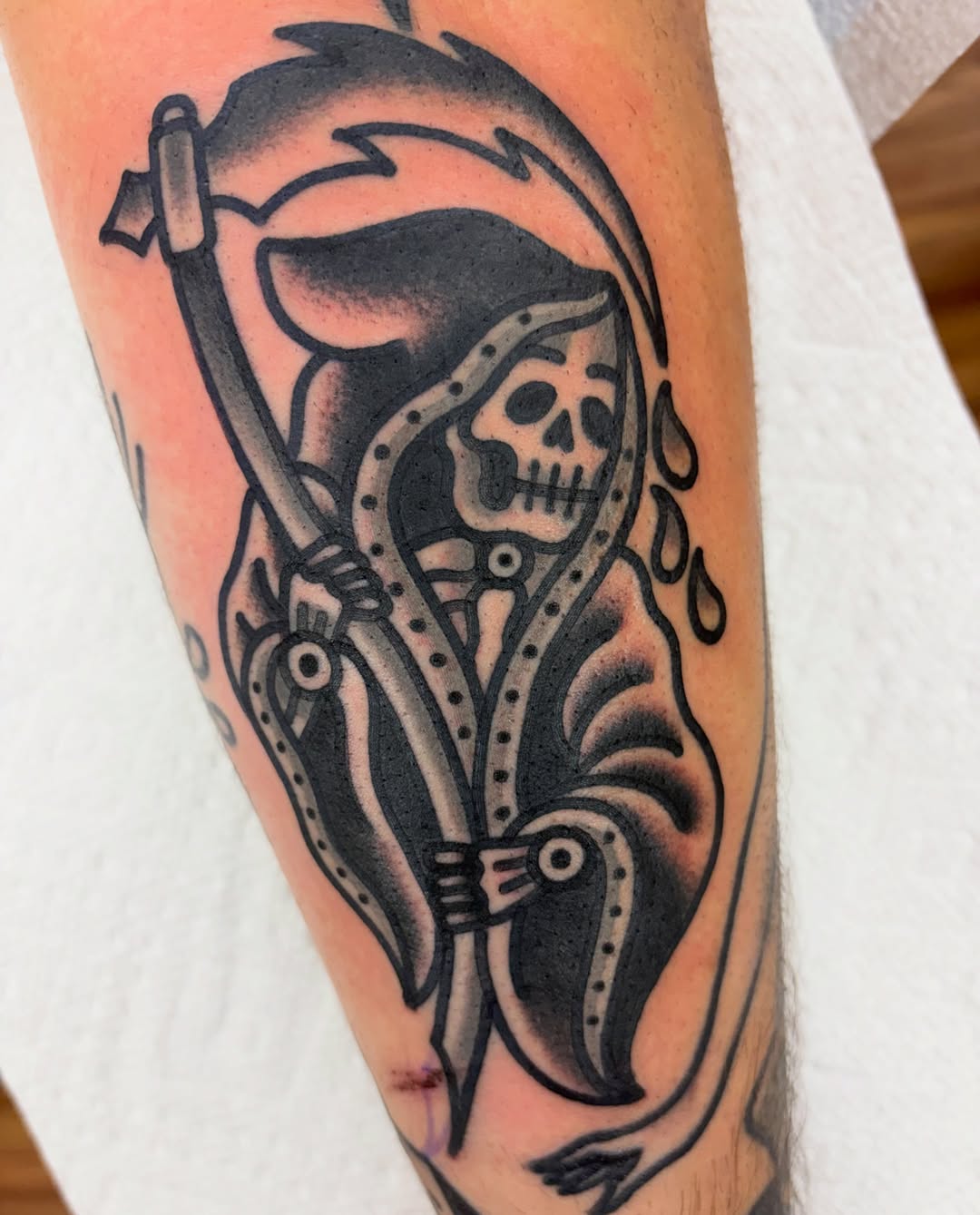 Grim reaper American traditional tattoo on the forearm by Adrian Godoy