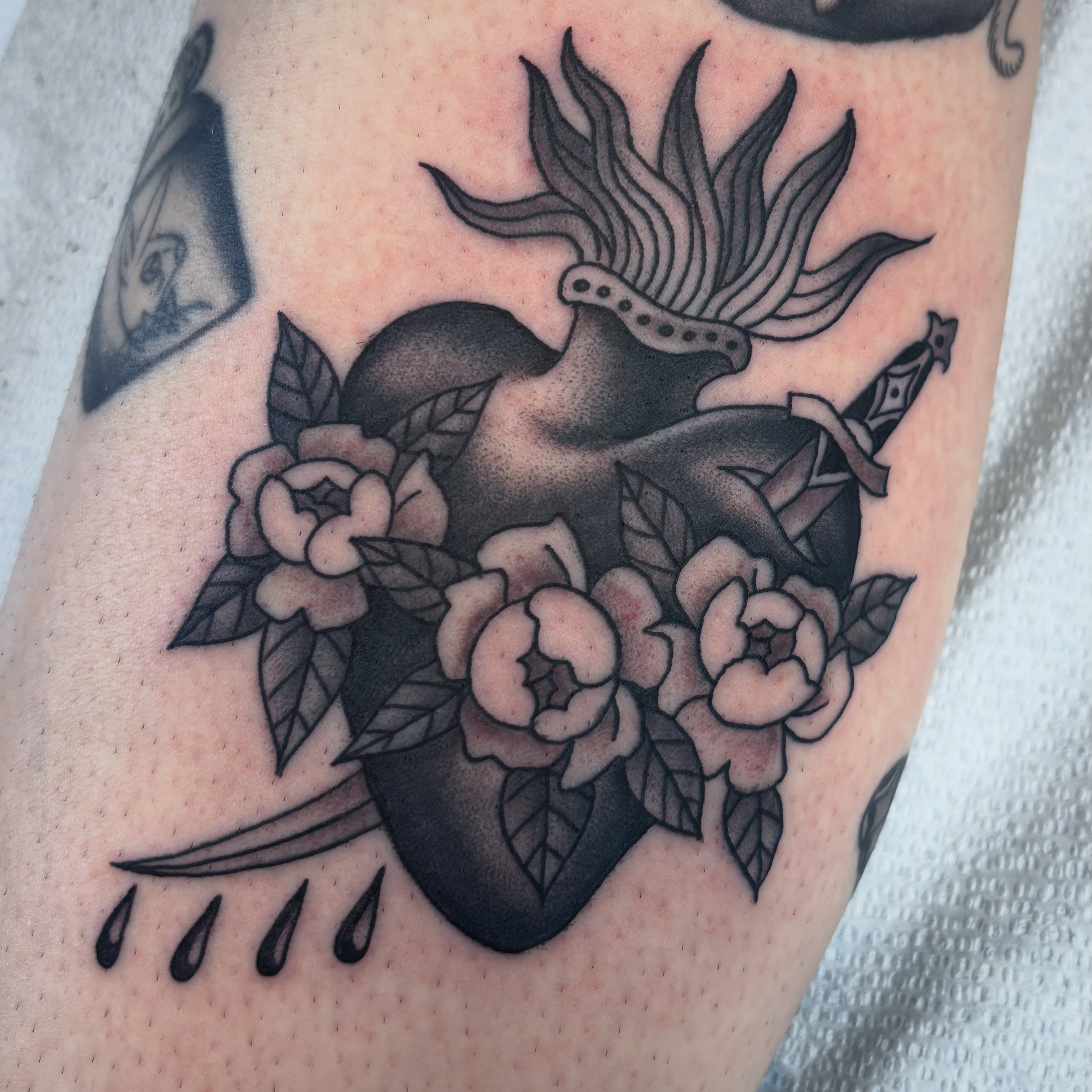 Deer and roses American traditional tattoo on the forearm by Adam Bailey, Portland, Oregon