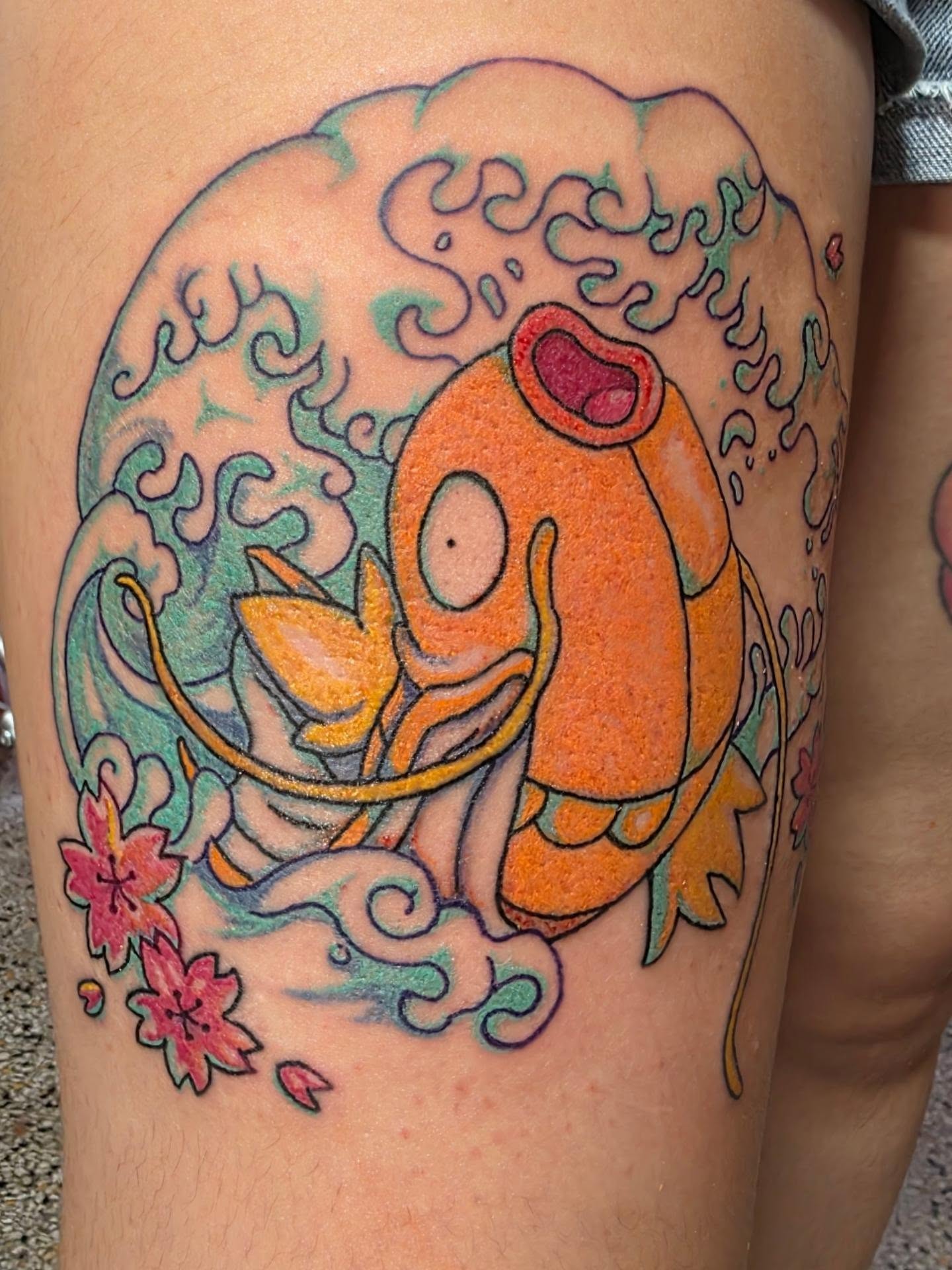Goldfish and waves japanese irezumi tattoo on the thigh by K.F. Golden