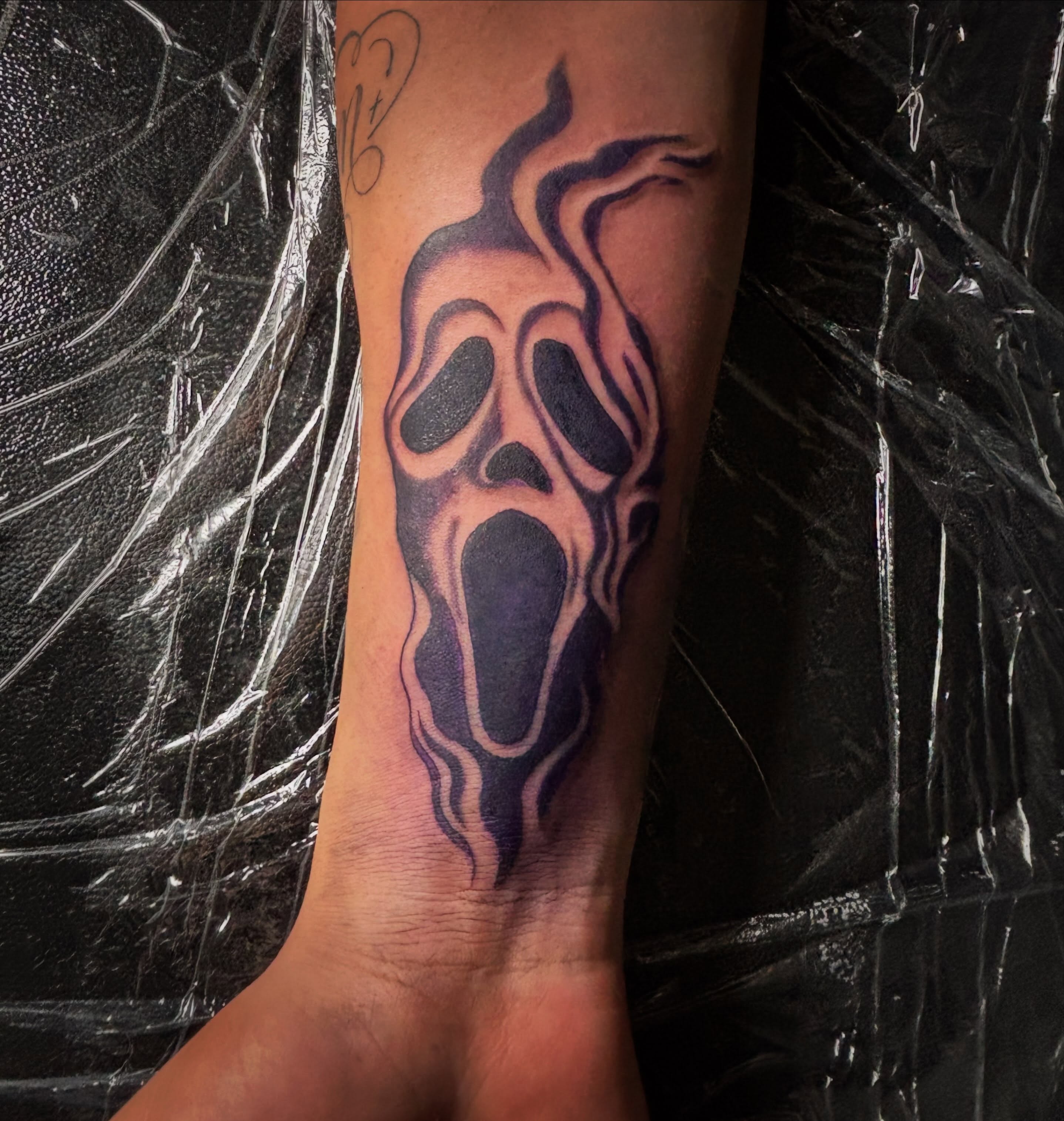 Ghost face neo-traditional tattoo on the forearm by Las Vegas Tattoo Artist ๐ฒโ๏ธ