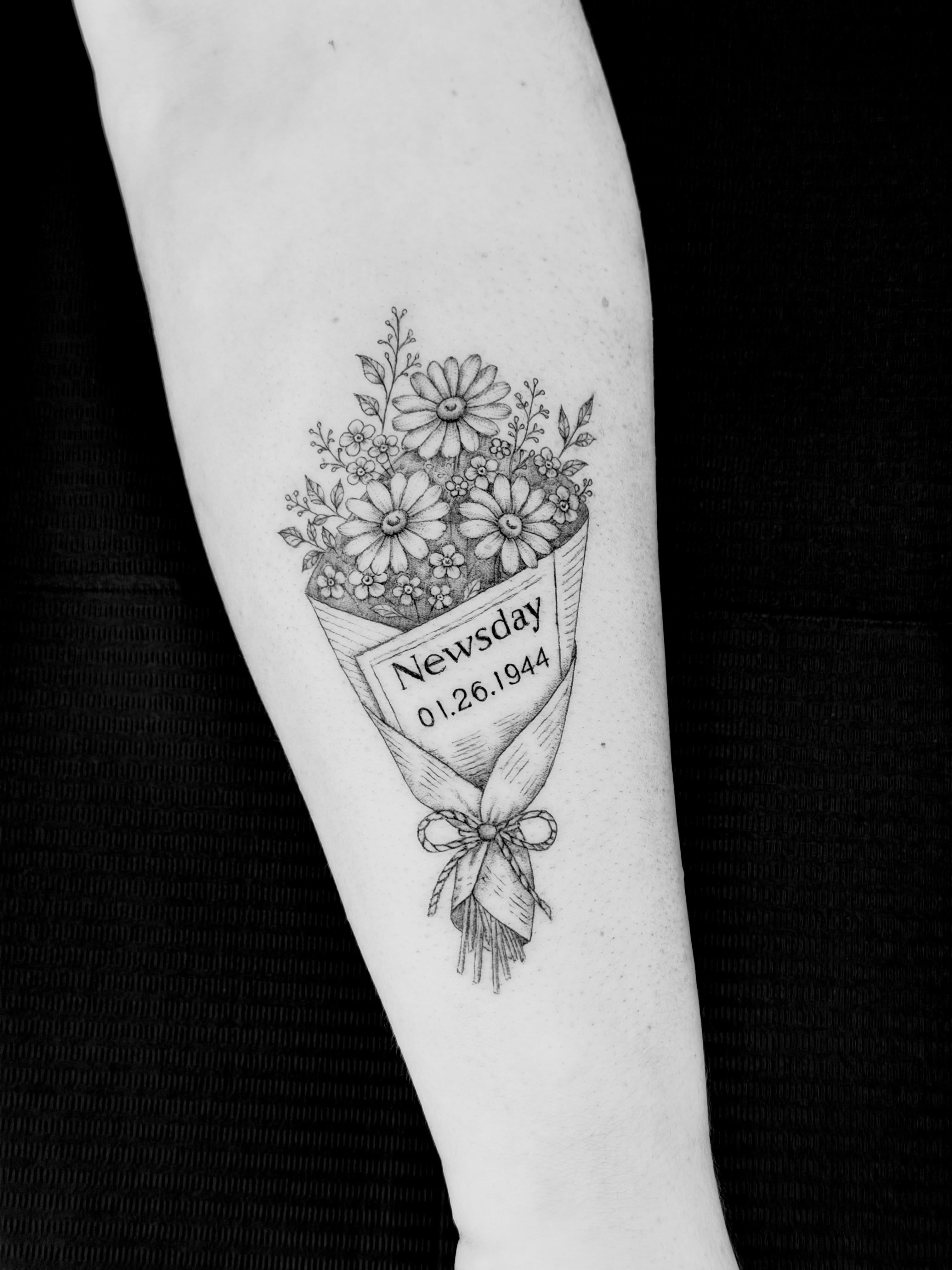 Flower bouquet black and grey tattoo on the forearm by Fine Line Tattoo Artist