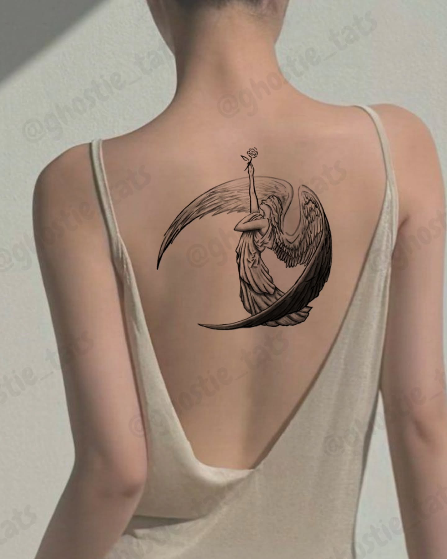 Angel with crescent moon realism tattoo on the back by Lina ๐ป