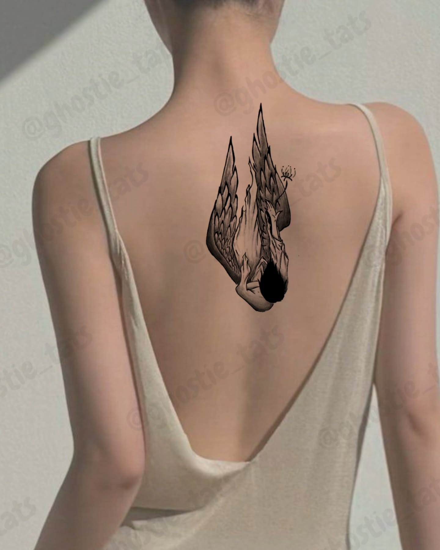 Winged creature black and grey tattoo on the back by Lina ๐ป