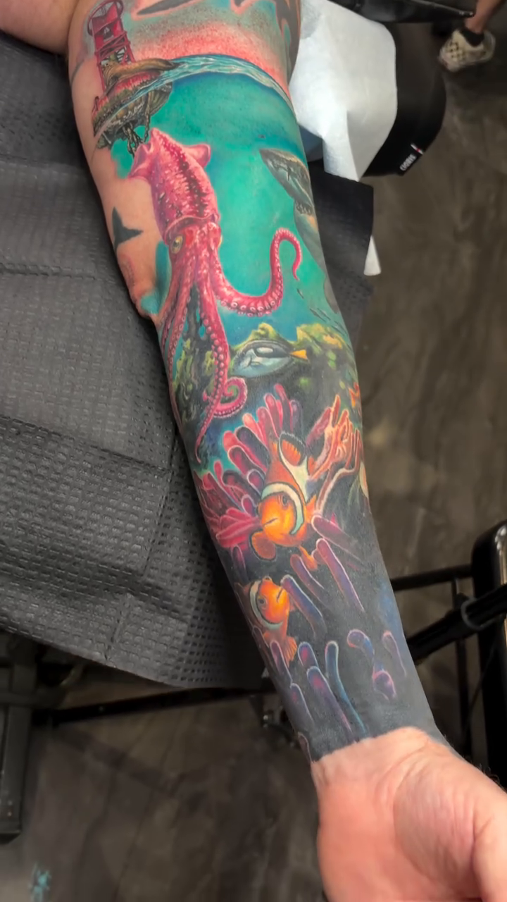 Underwater scene with kraken and lighthouse new school tattoo by 🦇𝖀𝖙𝖆𝖍🦇, Las Vegas, Nevada