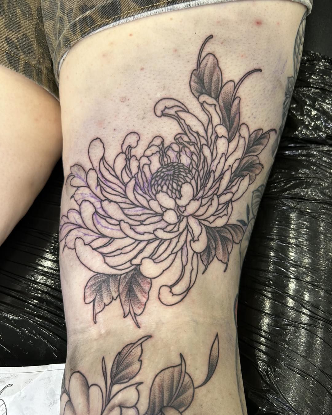 Chrysanthemum black and grey tattoo on the thigh by Room 5 Tattoo