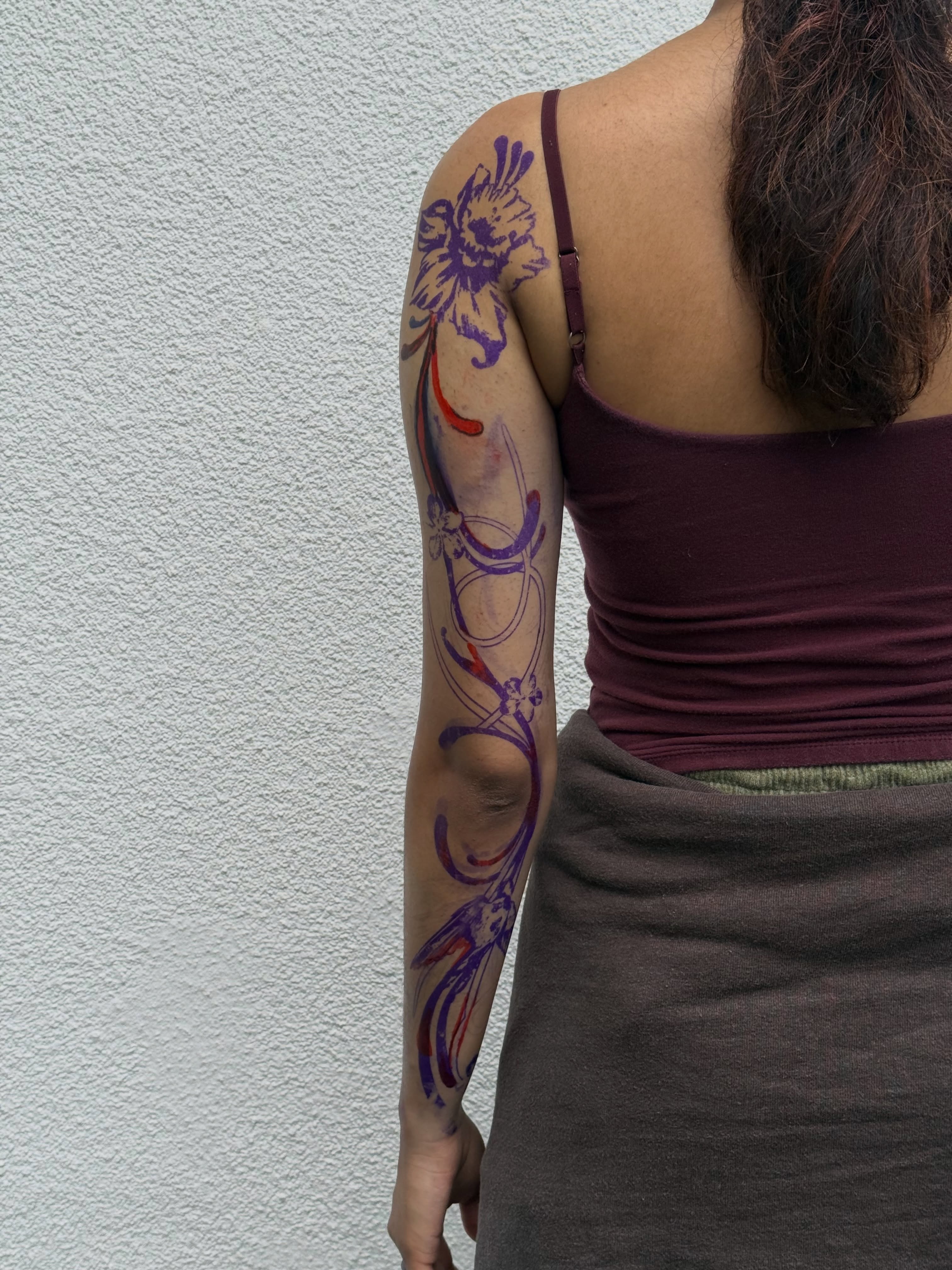 Floral design new school tattoo on the upper arm by Ava Nilou